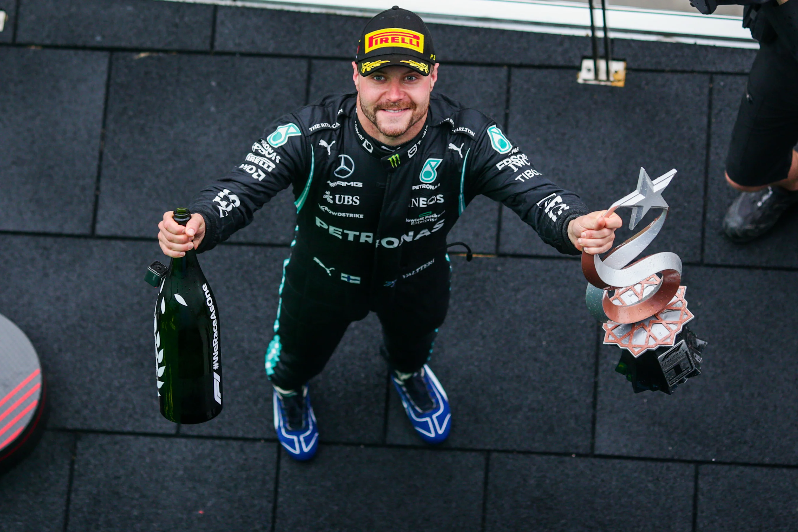 ISTANBUL, TURKEY - OCTOBER 10: Valterri Bottas of Mercedes and Finland celebrates winning during