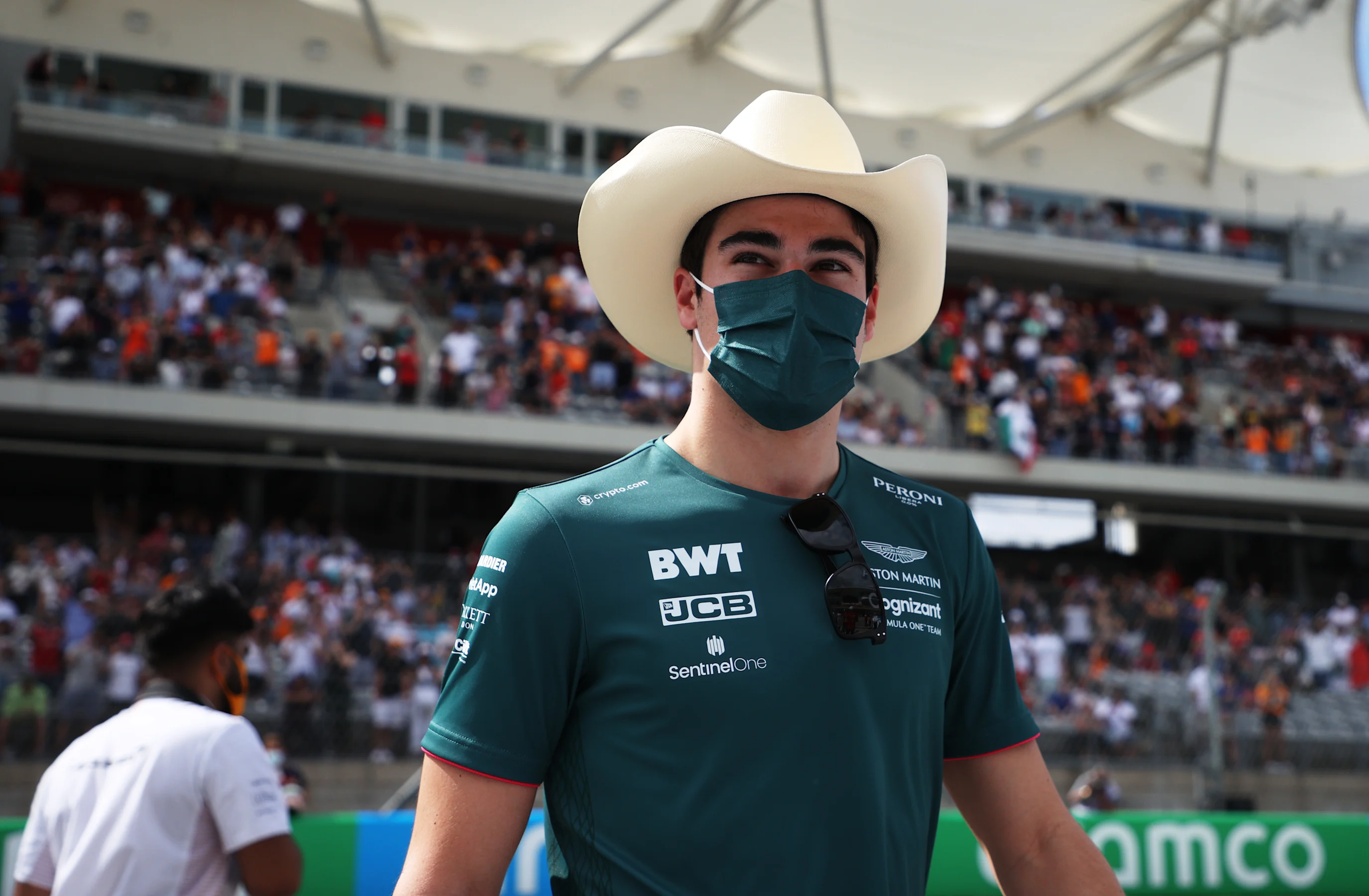 AUSTIN, TEXAS - OCTOBER 24: Lance Stroll of Canada and Aston Martin F1 Team walks in the Paddock