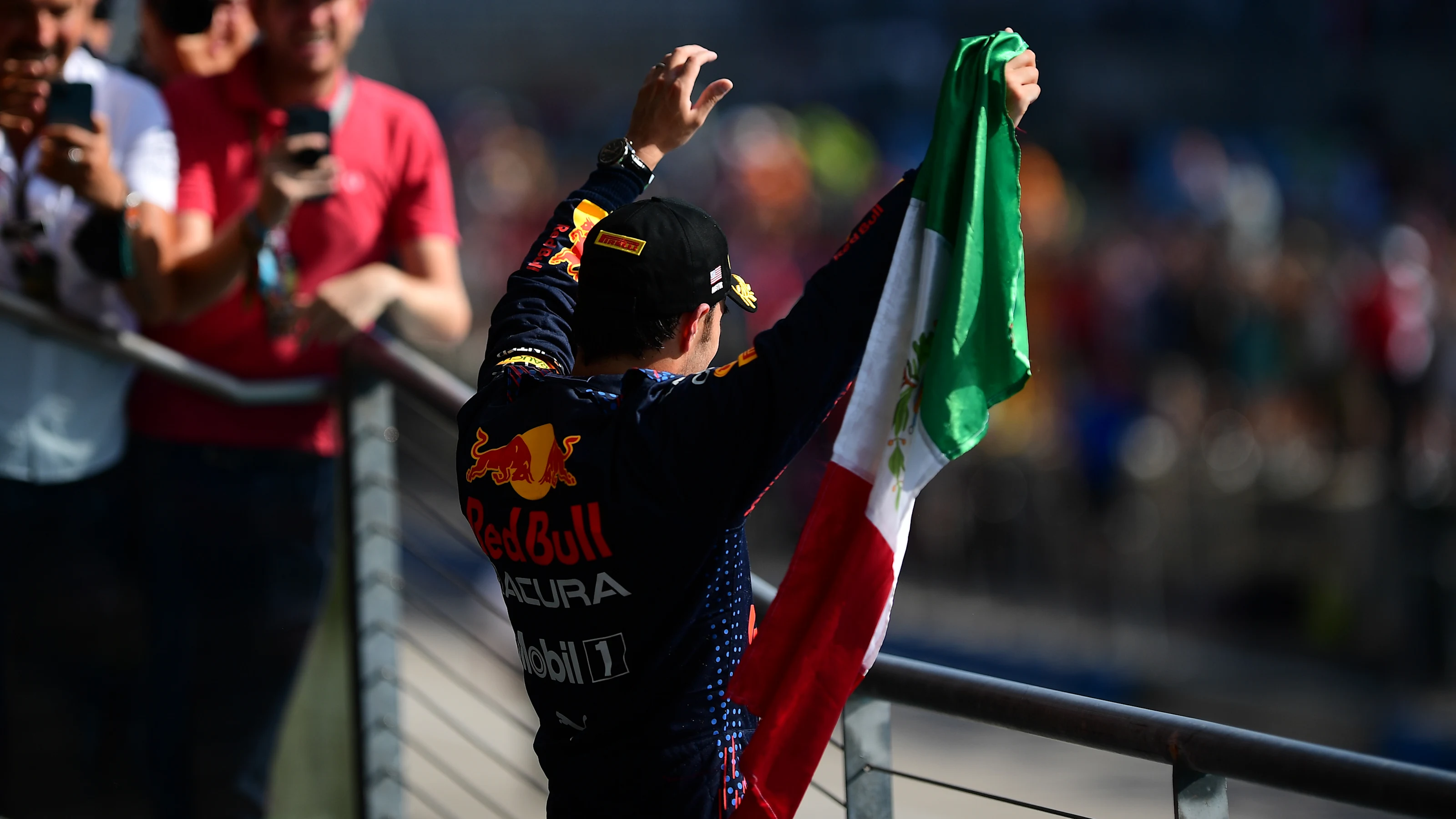 AUSTIN, TEXAS - OCTOBER 24: Third placed Sergio Perez of Mexico and Red Bull Racing celebrates on