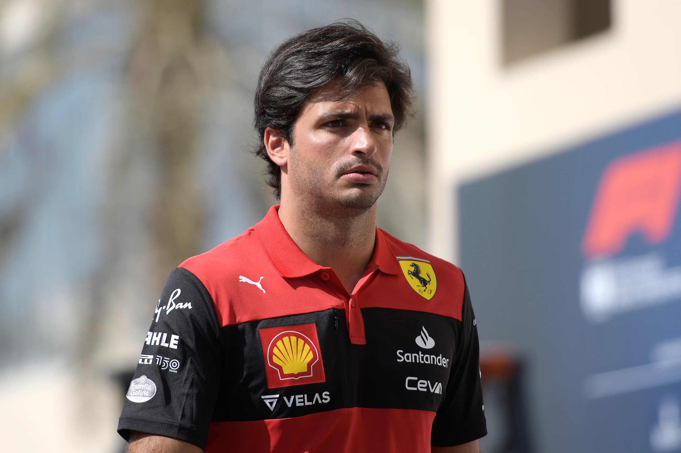 ABU DHABI, UNITED ARAB EMIRATES - NOVEMBER 18: Carlos Sainz of Spain and Ferrari walks in the