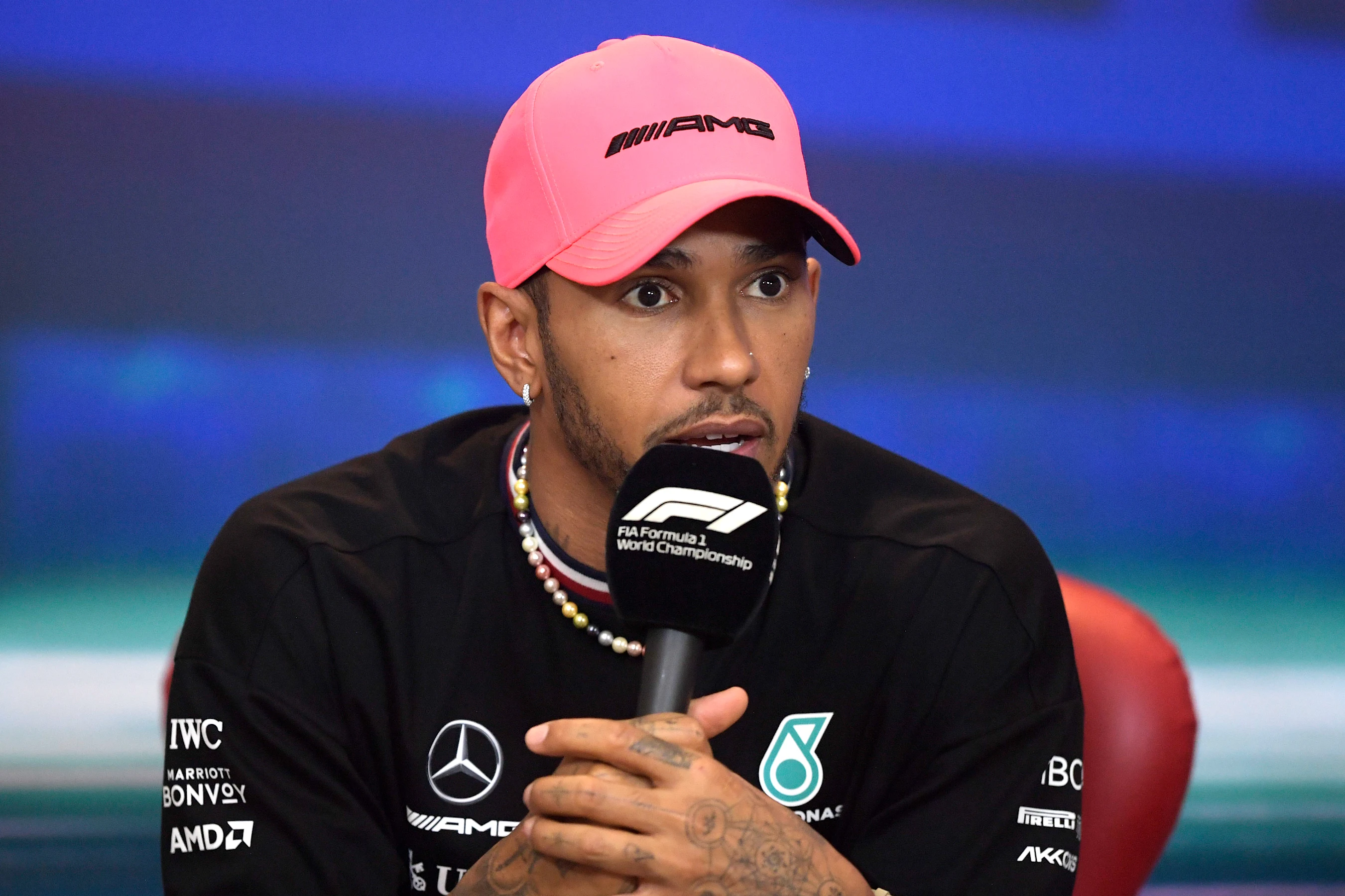 ABU DHABI, UNITED ARAB EMIRATES - NOVEMBER 17: Lewis Hamilton of Great Britain and Mercedes talks