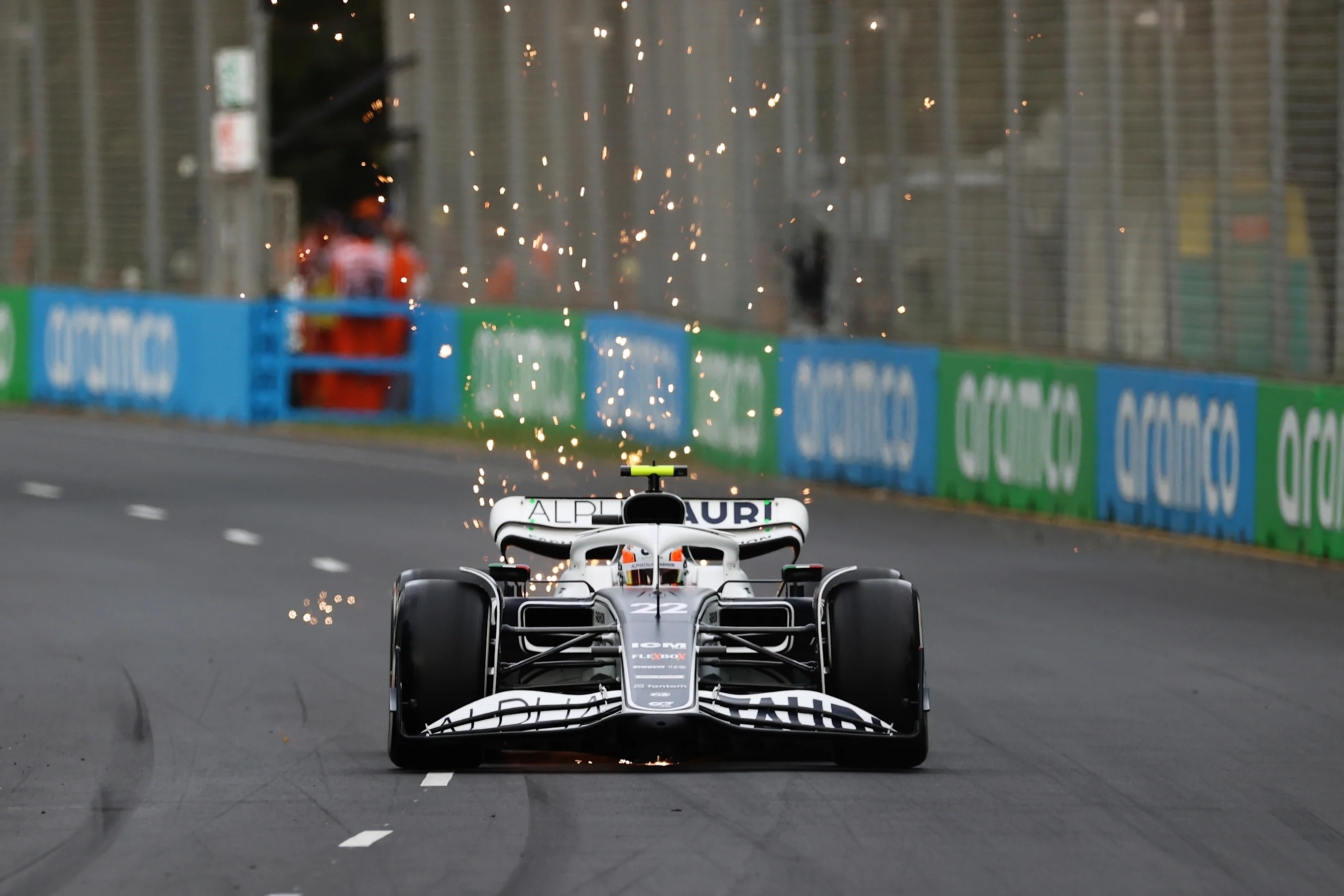 MELBOURNE, AUSTRALIA - APRIL 08: Sparks fly behind Yuki Tsunoda of Japan driving the (22) Scuderia