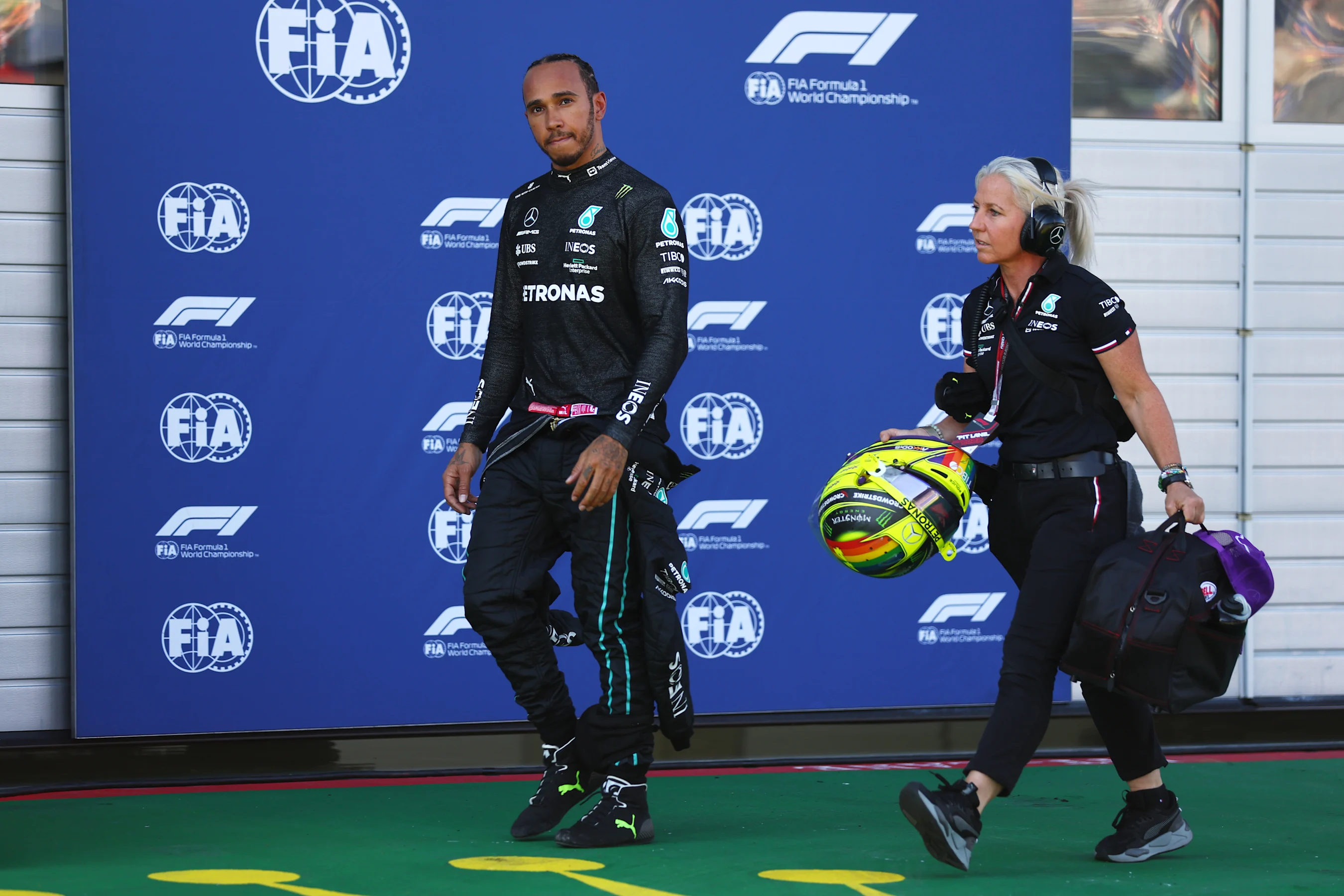 SPIELBERG, AUSTRIA - JULY 08: Lewis Hamilton of Great Britain and Mercedes walks in the Pitlane
