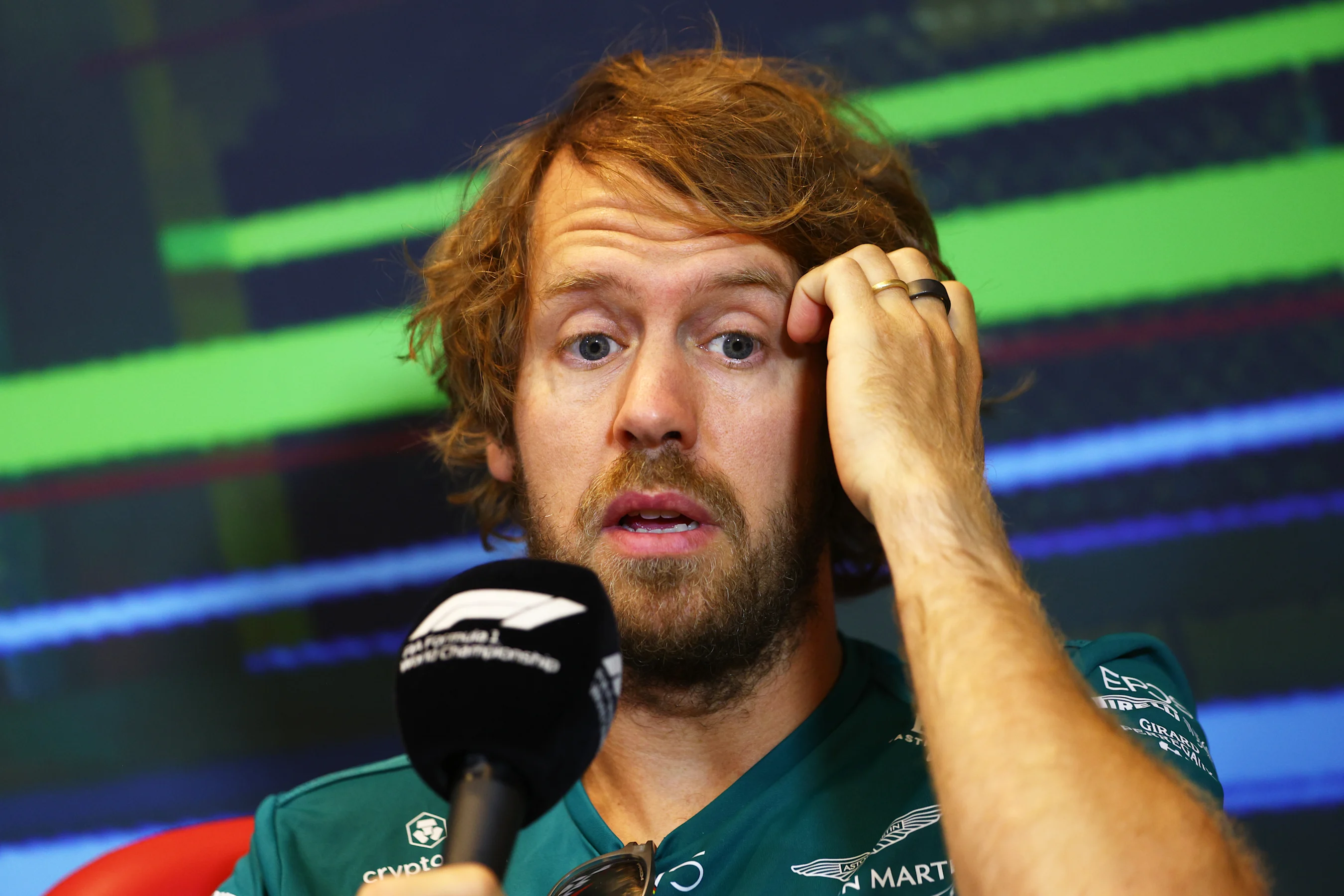 BAKU, AZERBAIJAN - JUNE 10: Sebastian Vettel of Germany and Aston Martin F1 Team talks in the