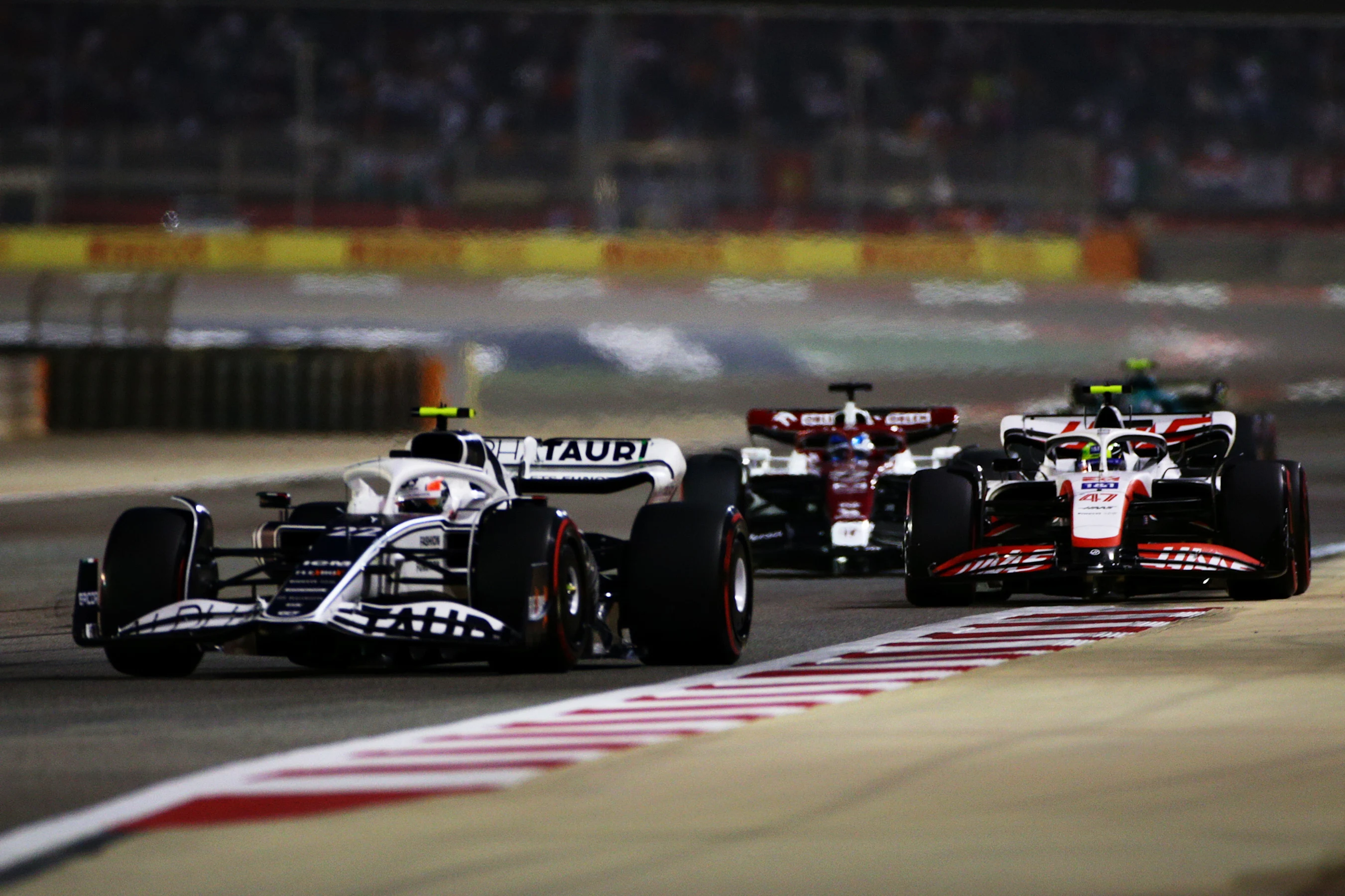 BAHRAIN, BAHRAIN - MARCH 20: Yuki Tsunoda of Japan driving the (22) Scuderia AlphaTauri AT03 leads