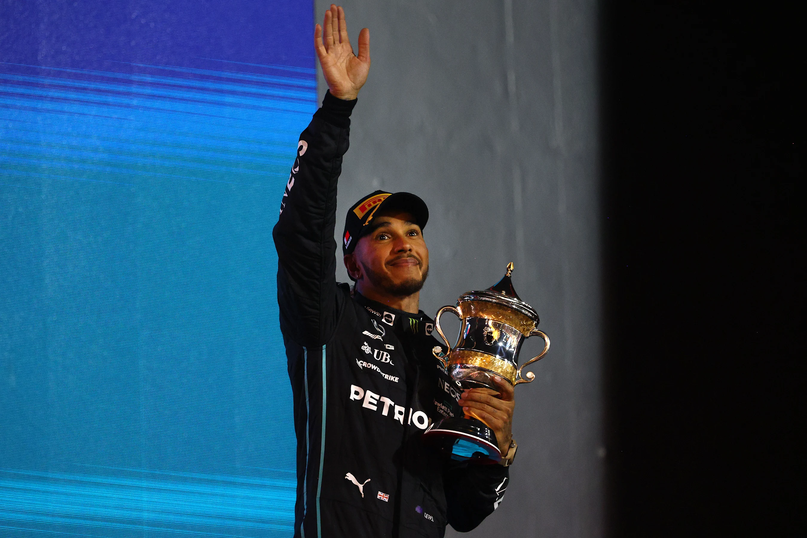 BAHRAIN, BAHRAIN - MARCH 20: Third placed Lewis Hamilton of Great Britain and Mercedes celebrates