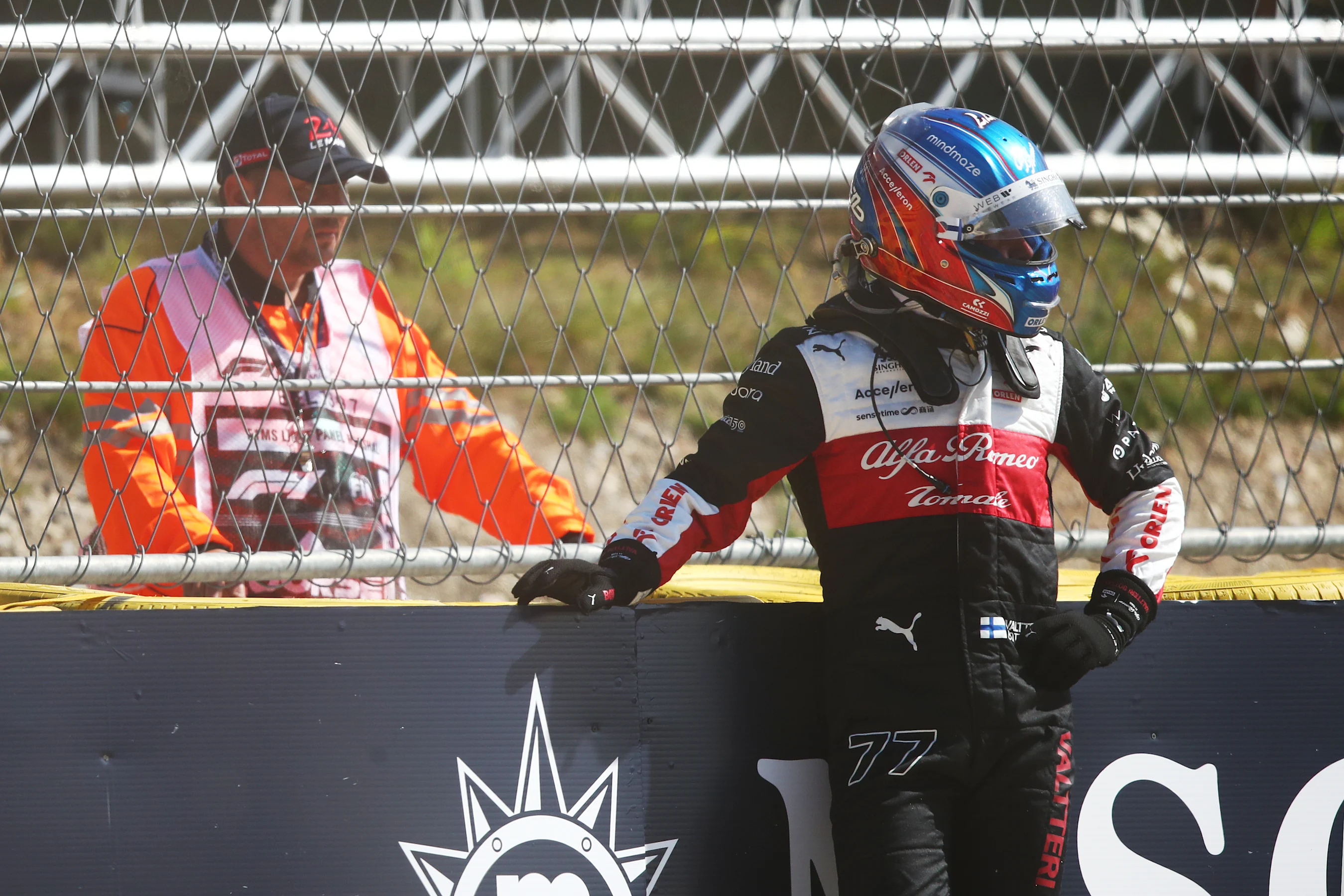 SPA, BELGIUM - AUGUST 28: Valtteri Bottas of Finland and Alfa Romeo F1 looks on from the barrier