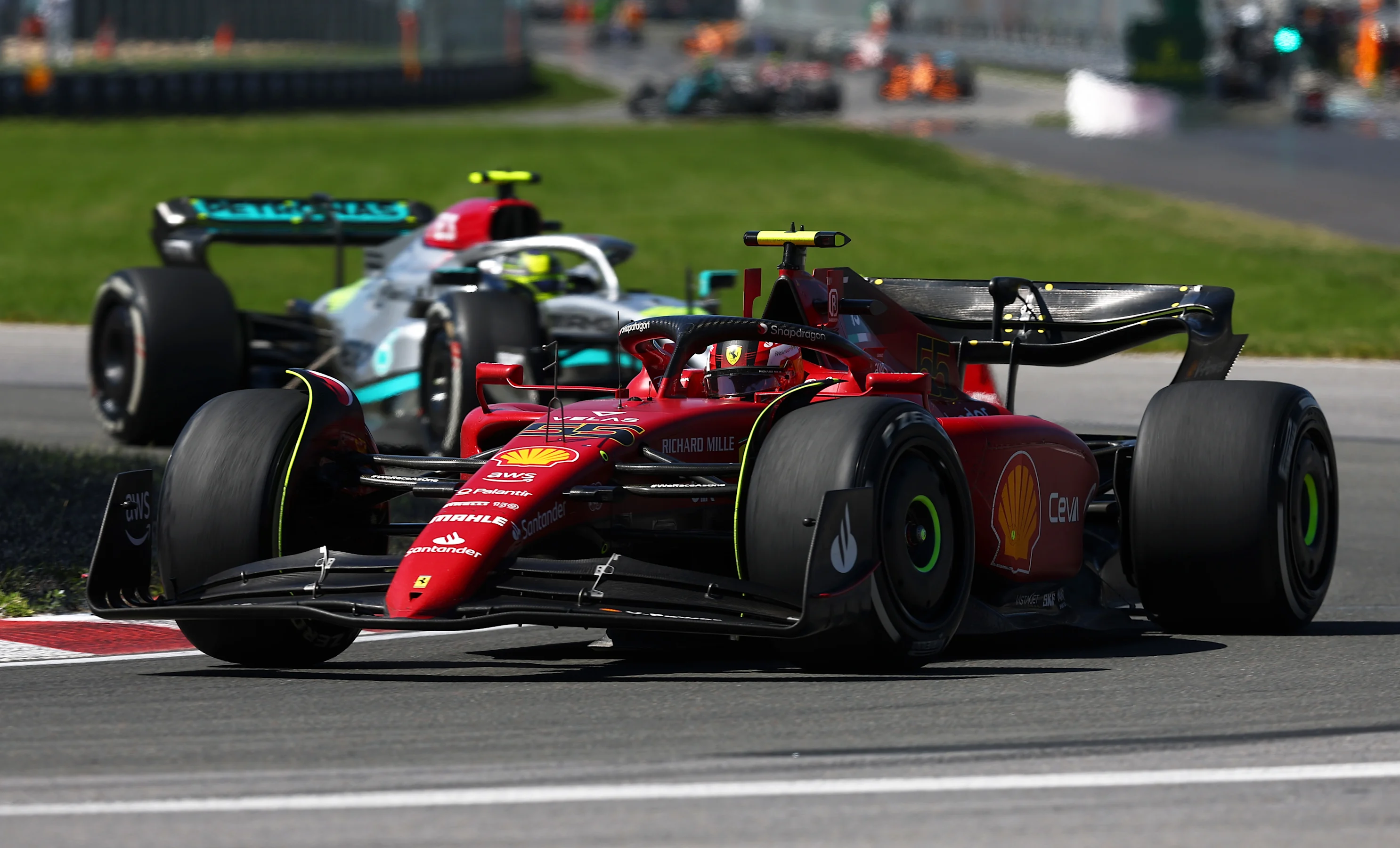 MONTREAL, QUEBEC - JUNE 19: Carlos Sainz of Spain driving (55) the Ferrari F1-75 leads Lewis