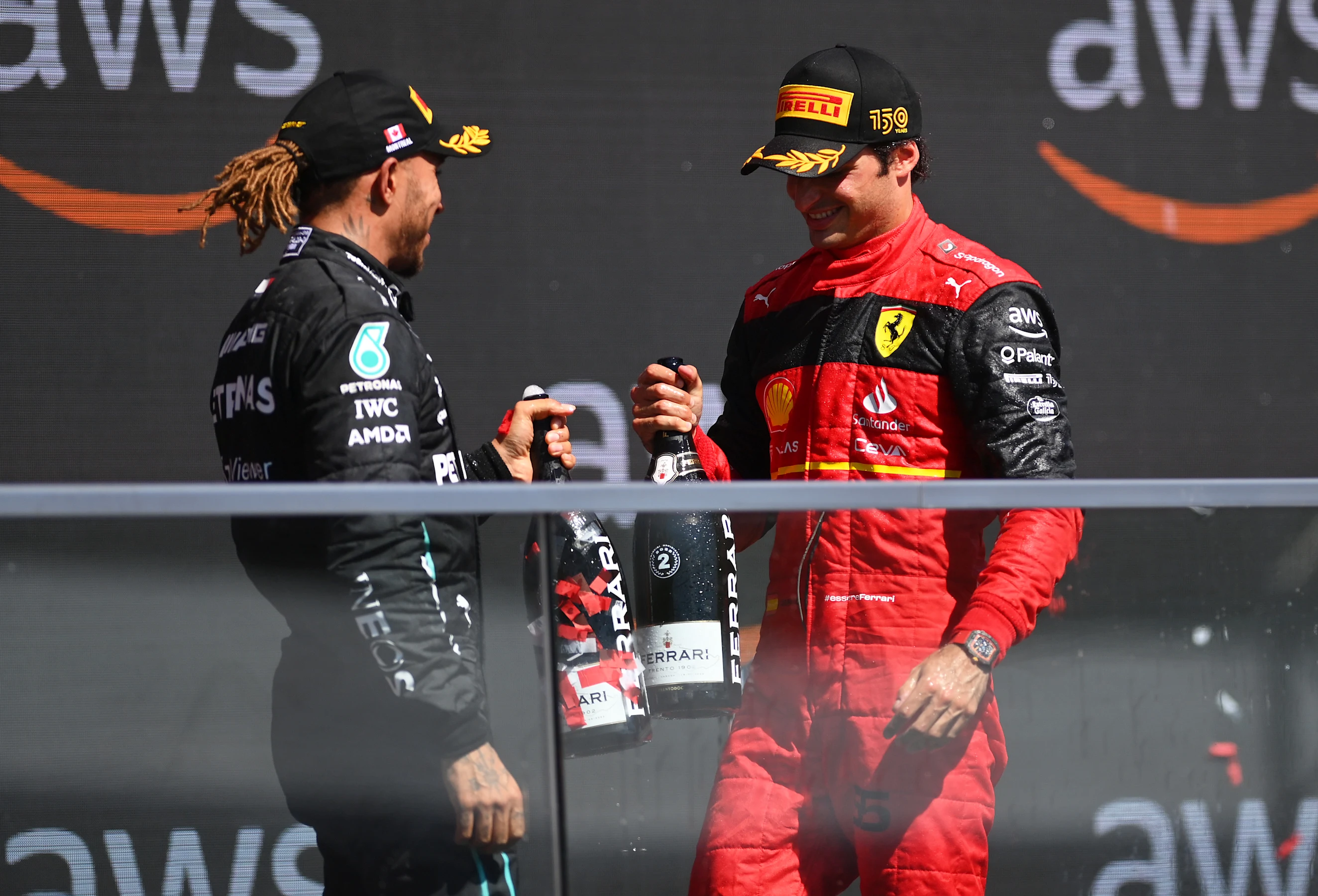 MONTREAL, QUEBEC - JUNE 19: Second placed Carlos Sainz of Spain and Ferrari and Third placed Lewis