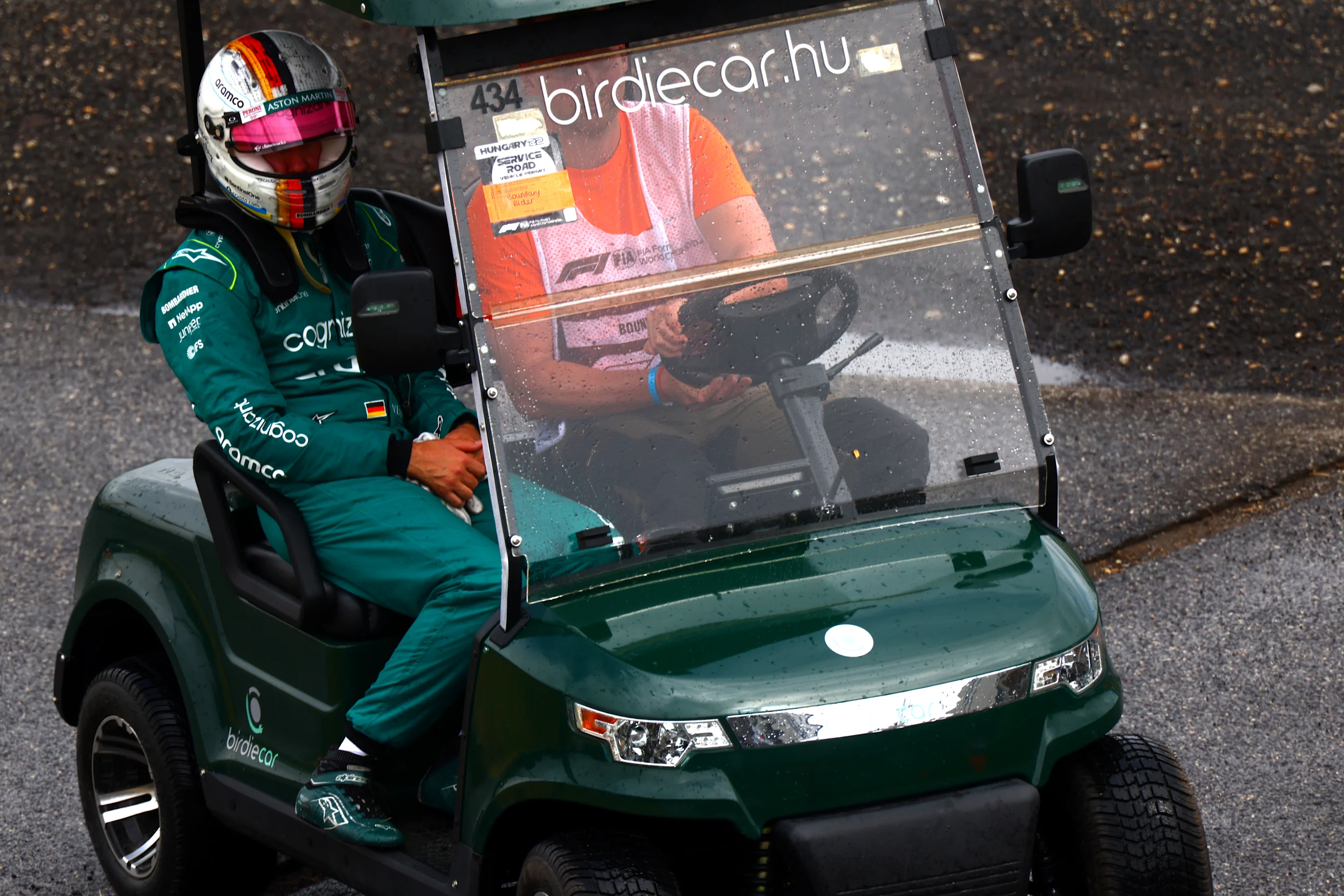 BUDAPEST, HUNGARY - JULY 30: Sebastian Vettel of Germany and Aston Martin F1 Team gets a lift back