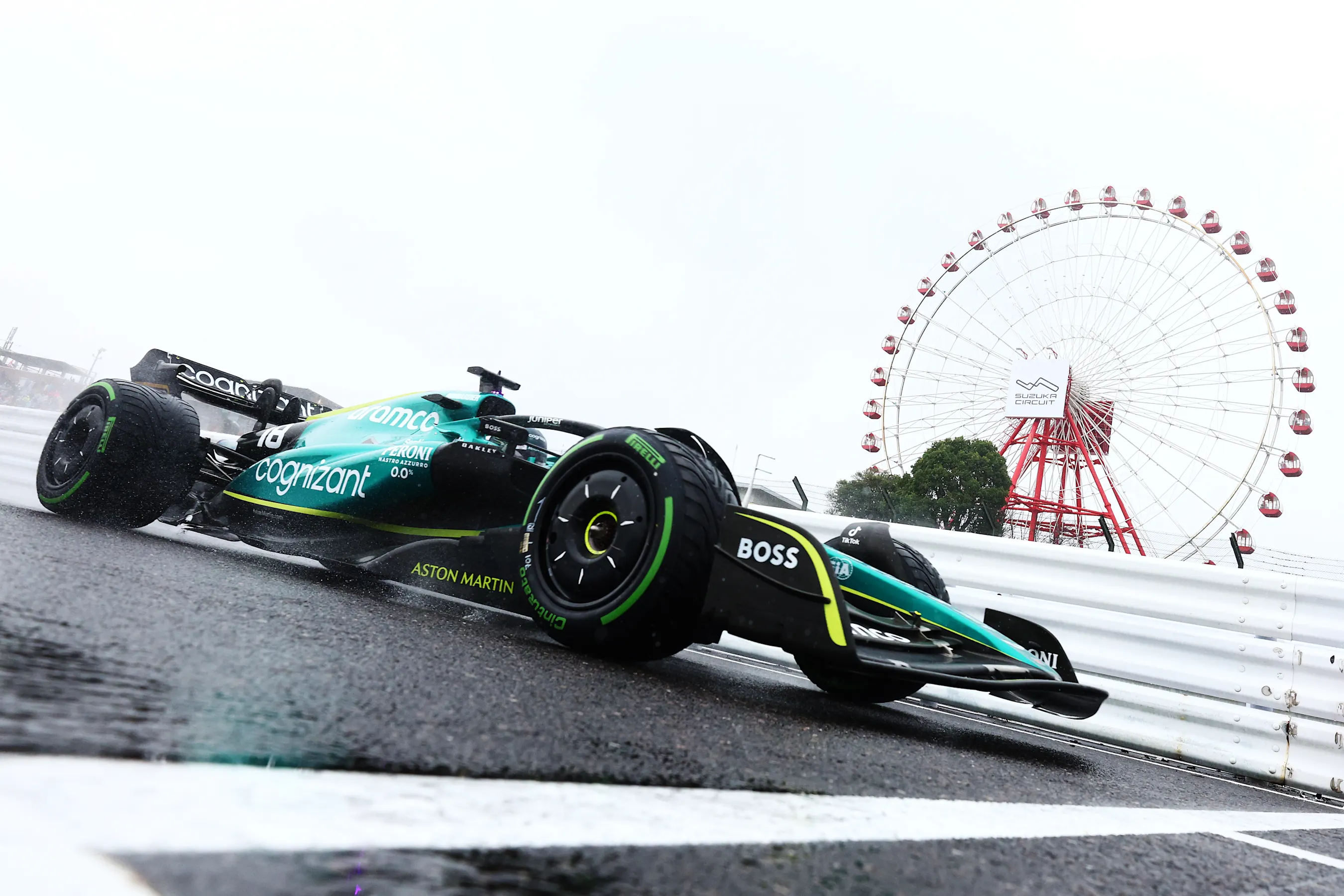 SUZUKA, JAPAN - OCTOBER 07: Lance Stroll of Canada driving the (18) Aston Martin AMR22 Mercedes on