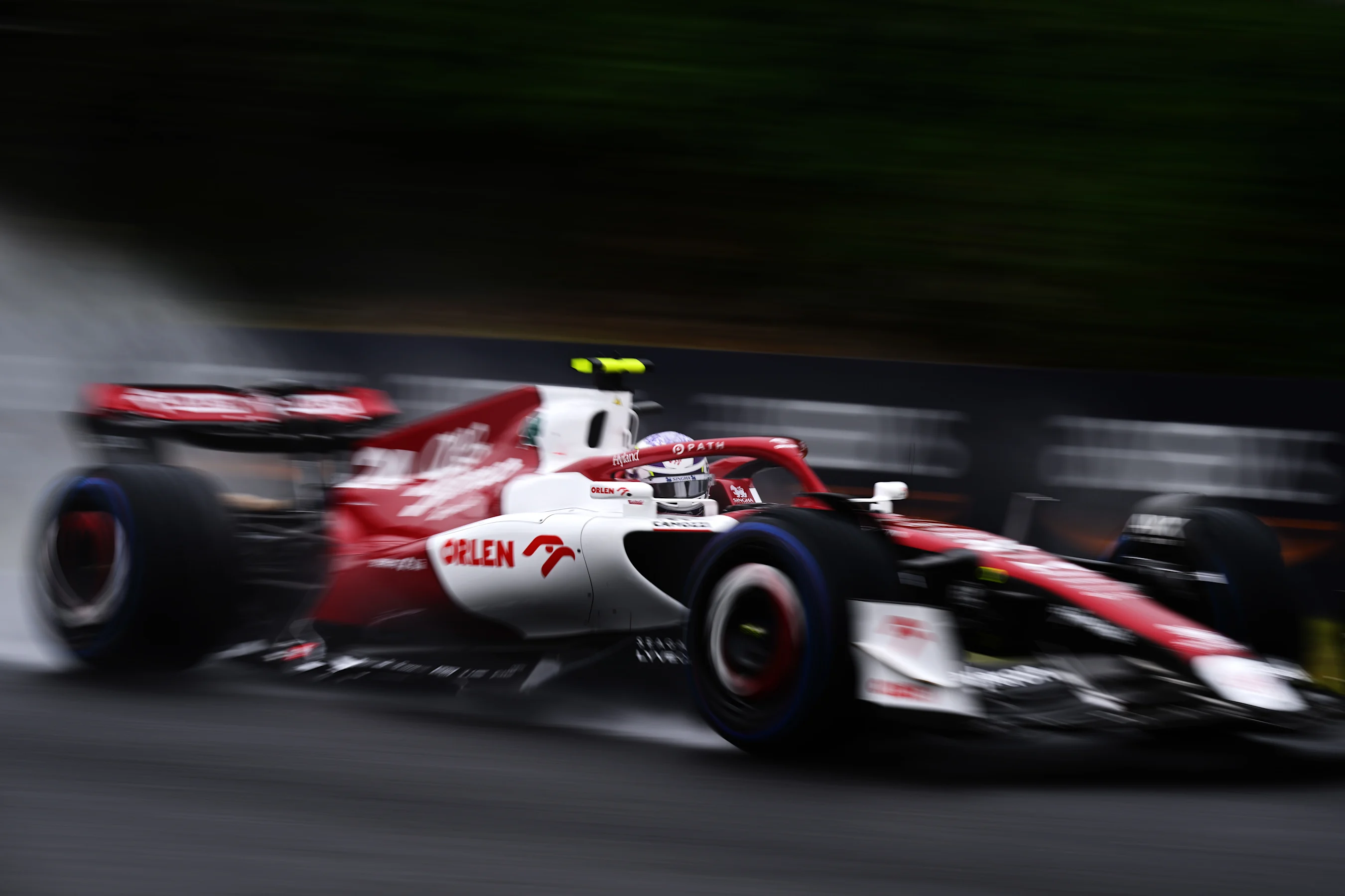 SUZUKA, JAPAN - OCTOBER 07: Zhou Guanyu of China driving the (24) Alfa Romeo F1 C42 Ferrari on