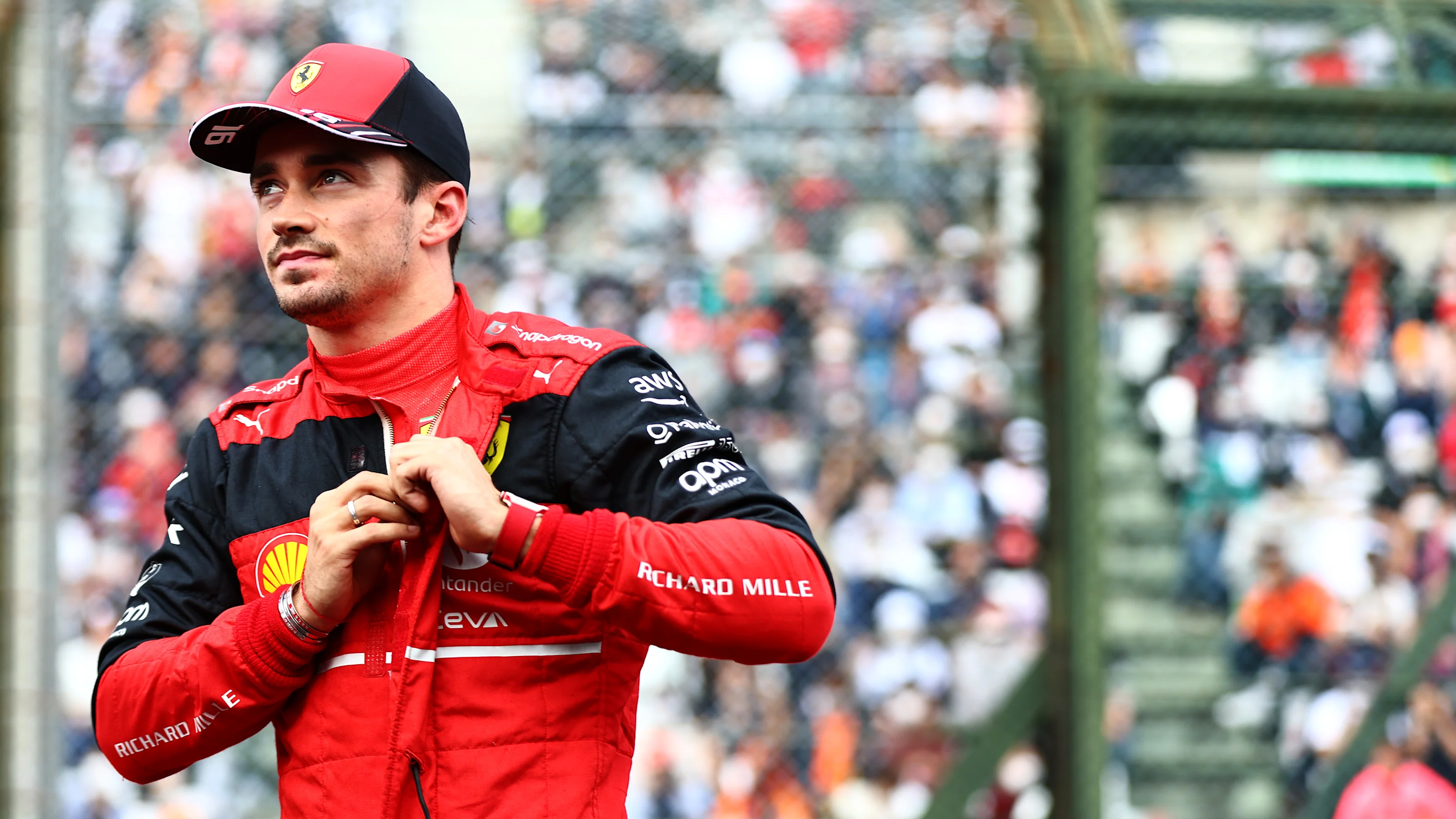 SUZUKA, JAPAN - OCTOBER 08: Second placed qualifier Charles Leclerc of Monaco and Ferrari looks on