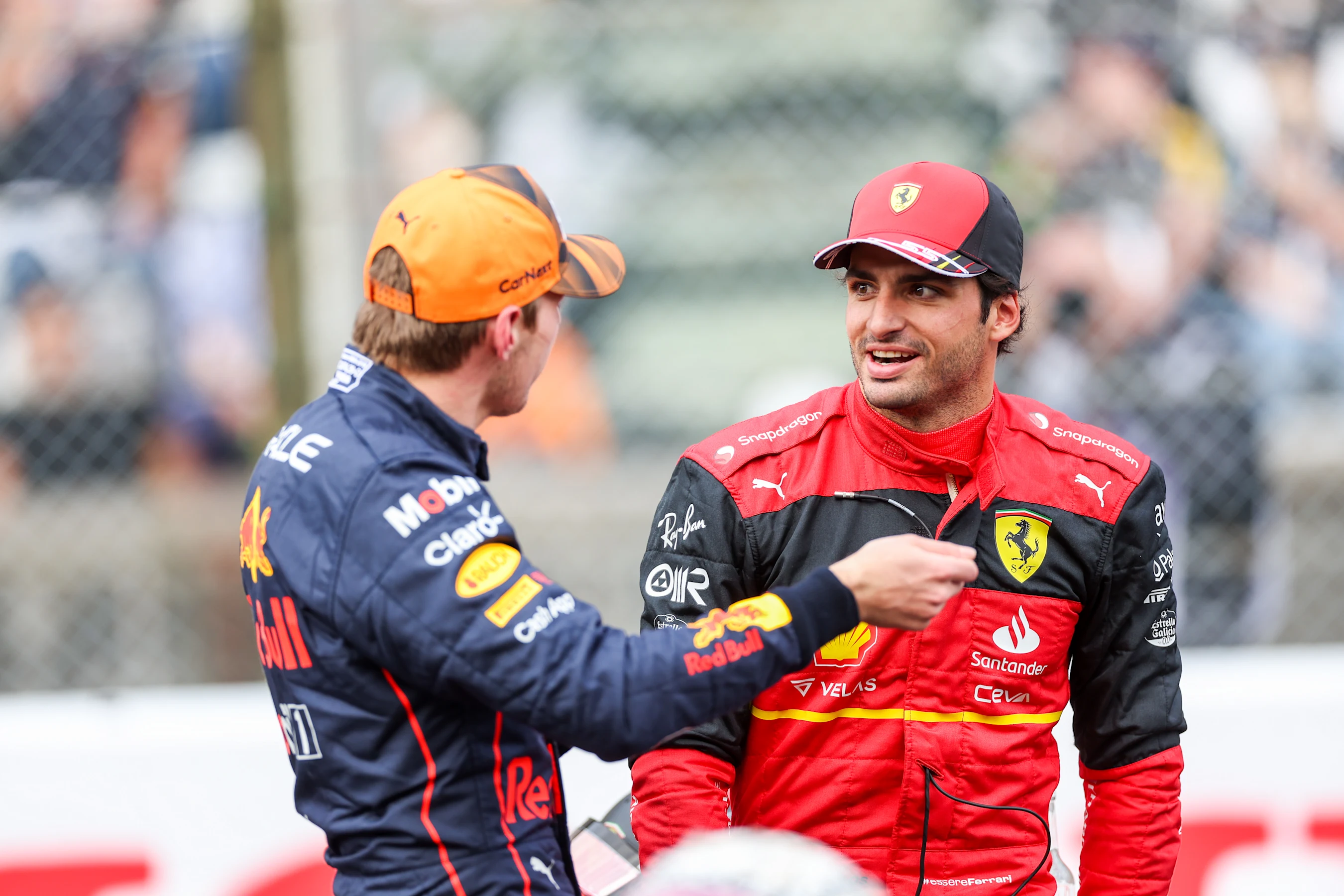 SUZUKA, JAPAN - OCTOBER 08: Max Verstappen of Red Bull Racing and The Netherlands hats with Carlos