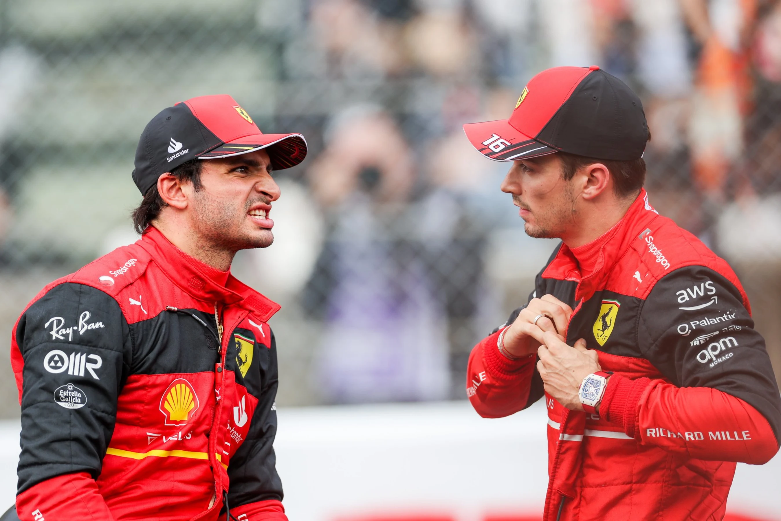 SUZUKA, JAPAN - OCTOBER 08: Carlos Sainz of Ferrari and Spain chats with Charles Leclerc of Ferrari