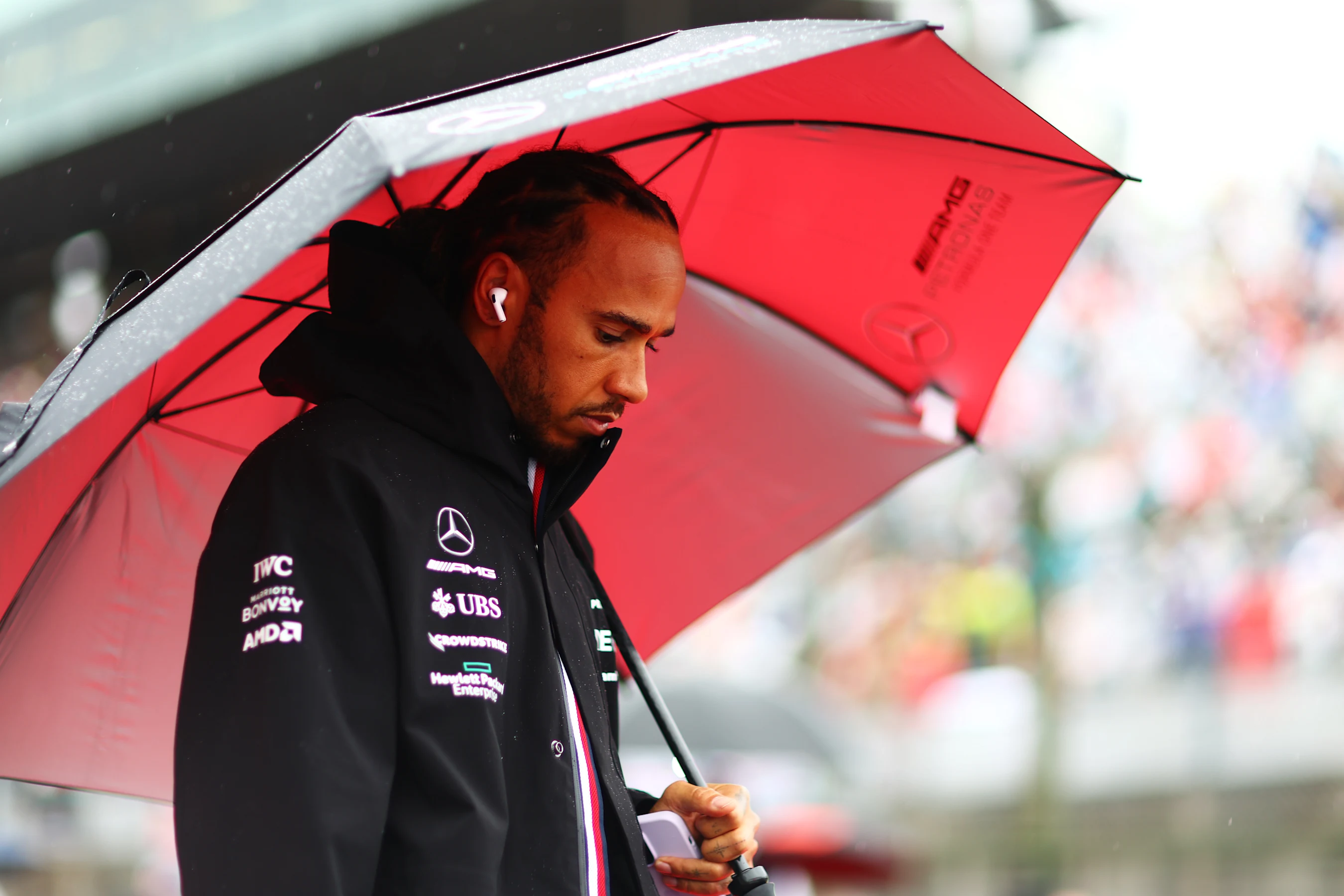 SUZUKA, JAPAN - OCTOBER 09: Lewis Hamilton of Great Britain and Mercedes looks on from the grid