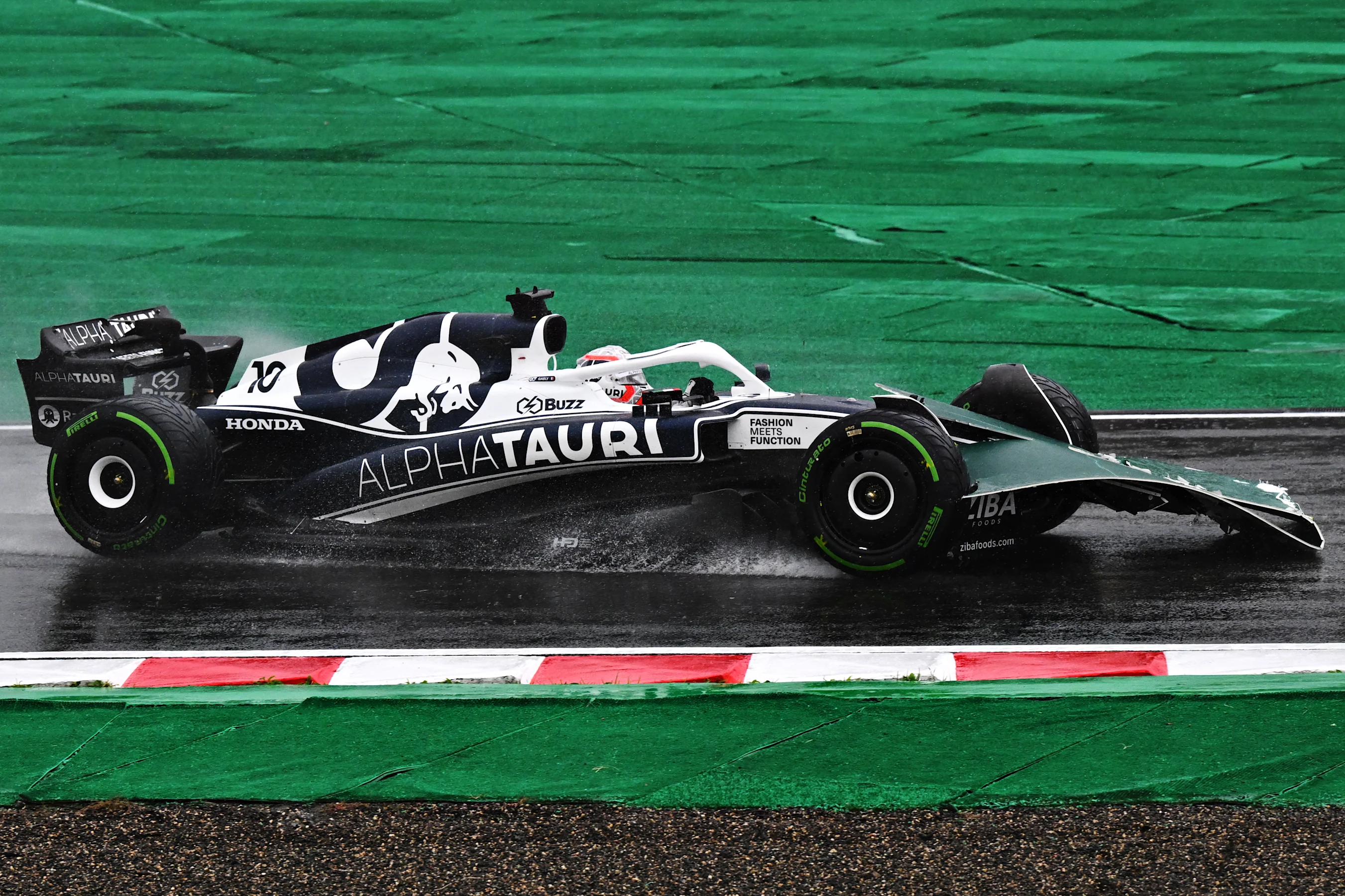 SUZUKA, JAPAN - OCTOBER 09: Pierre Gasly of France driving the (10) Scuderia AlphaTauri AT03 on