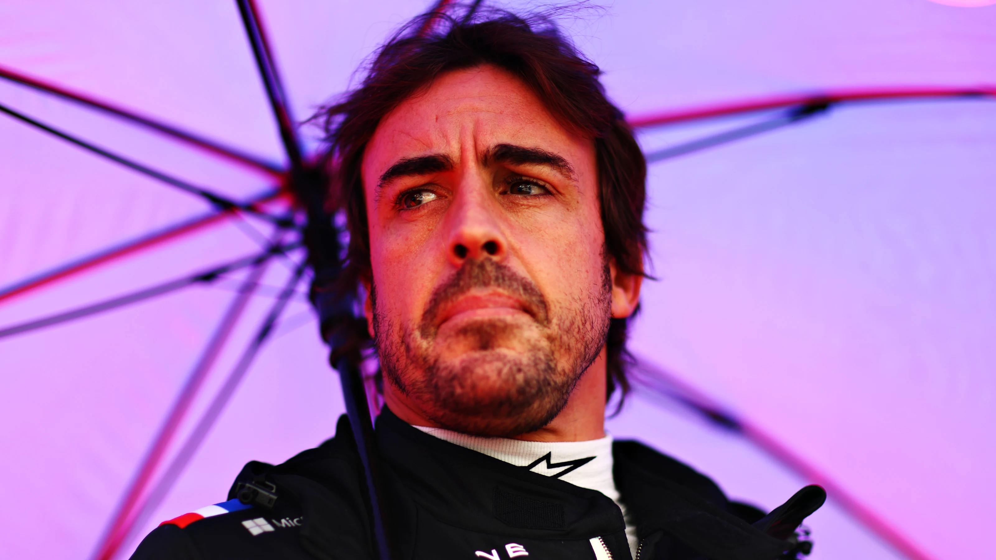 SUZUKA, JAPAN - OCTOBER 09: Fernando Alonso of Spain and Alpine F1 looks on from the grid during