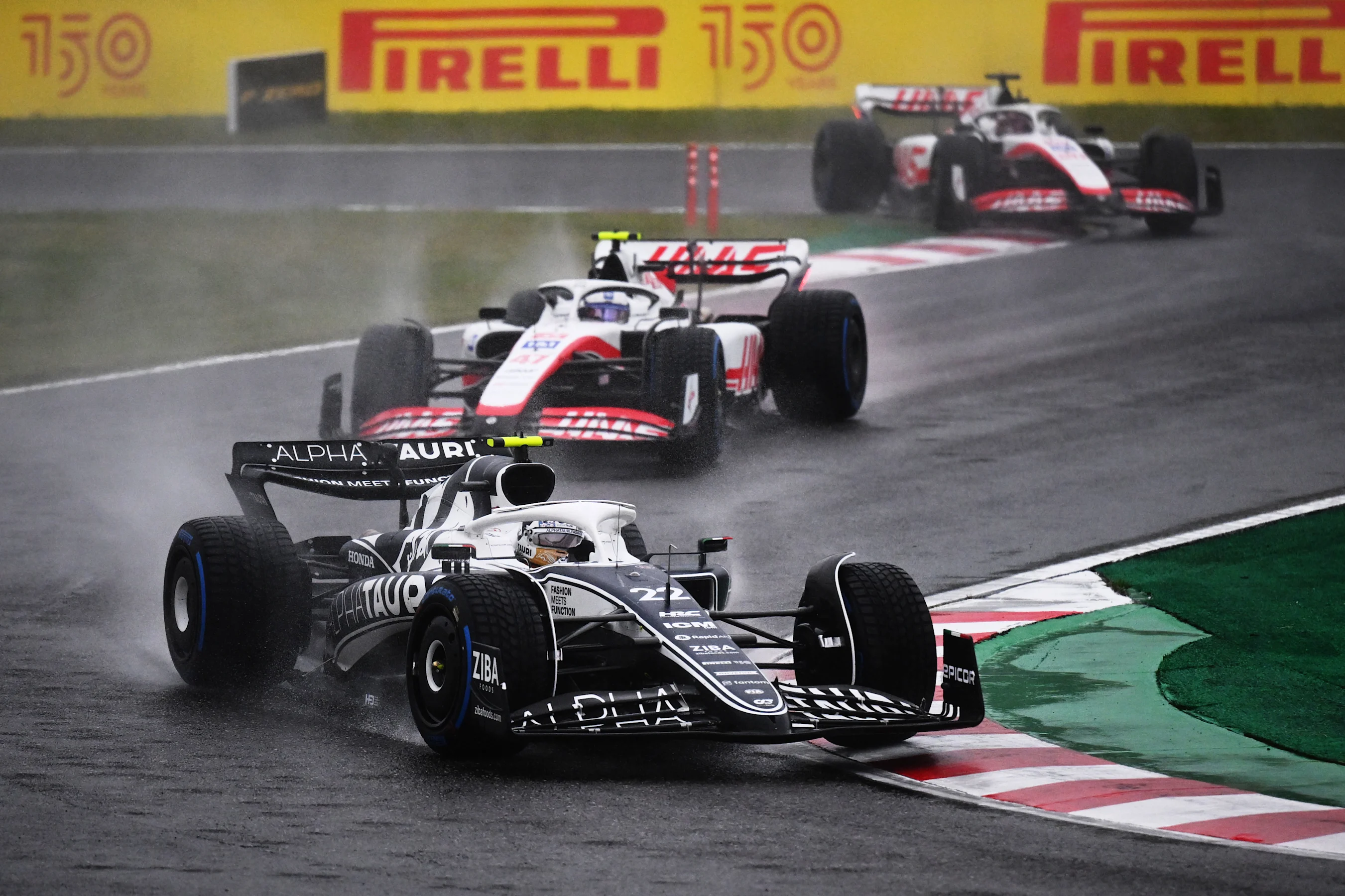 SUZUKA, JAPAN - OCTOBER 09: Yuki Tsunoda of Japan driving the (22) Scuderia AlphaTauri AT03 leads