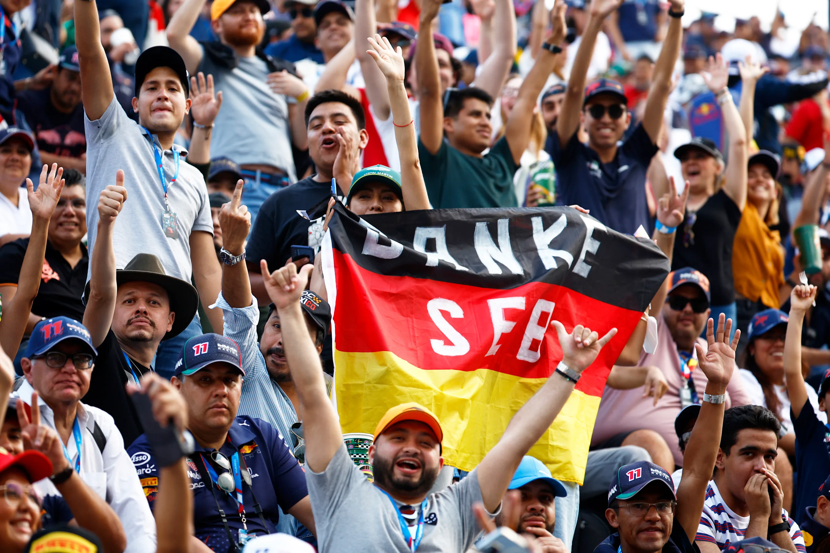 MEXICO CITY, MEXICO - OCTOBER 28: Sebastian Vettel of Germany and Aston Martin F1 Team fans show