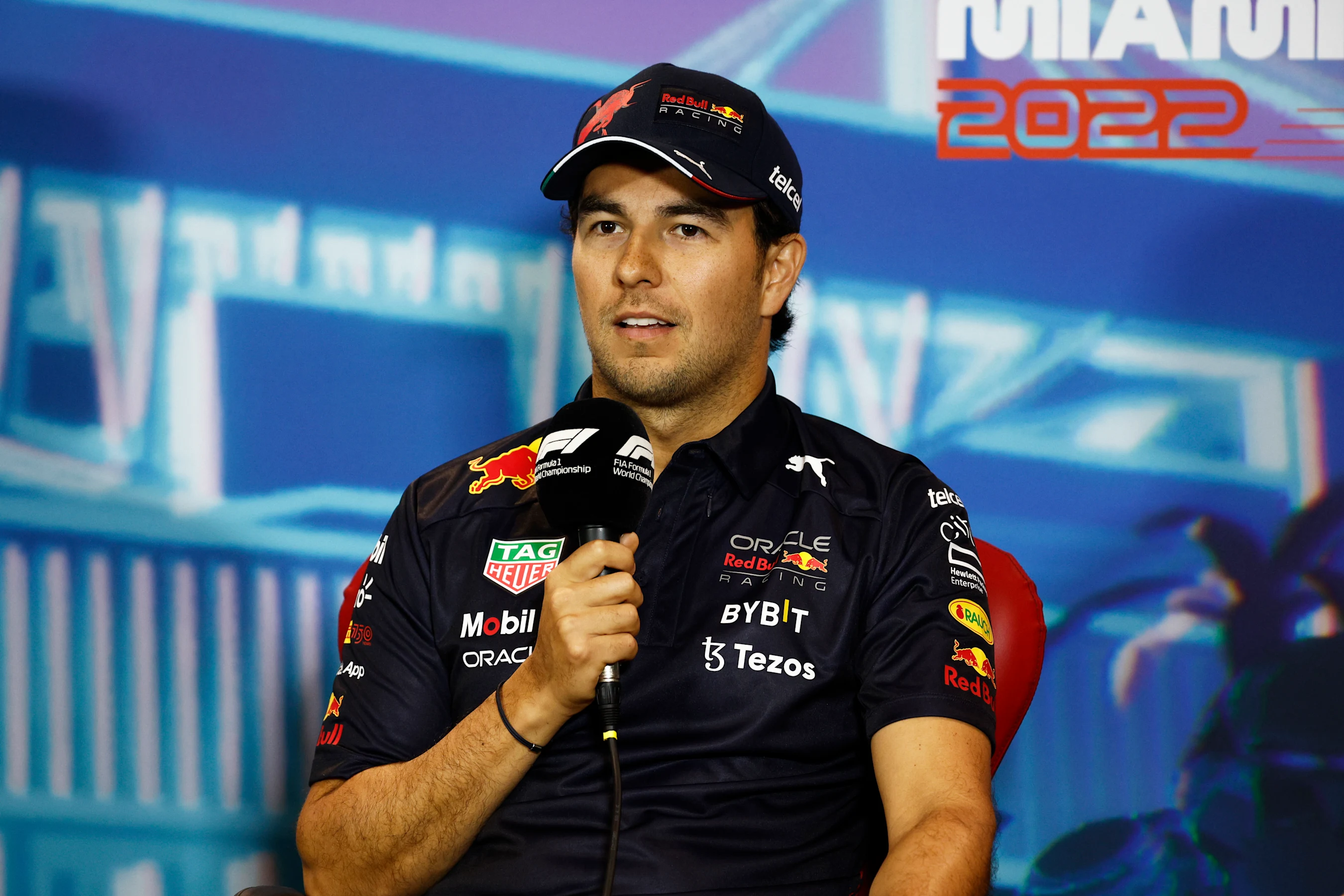 MIAMI, FLORIDA - MAY 06: Sergio Perez of Mexico and Oracle Red Bull Racing talks in the Drivers