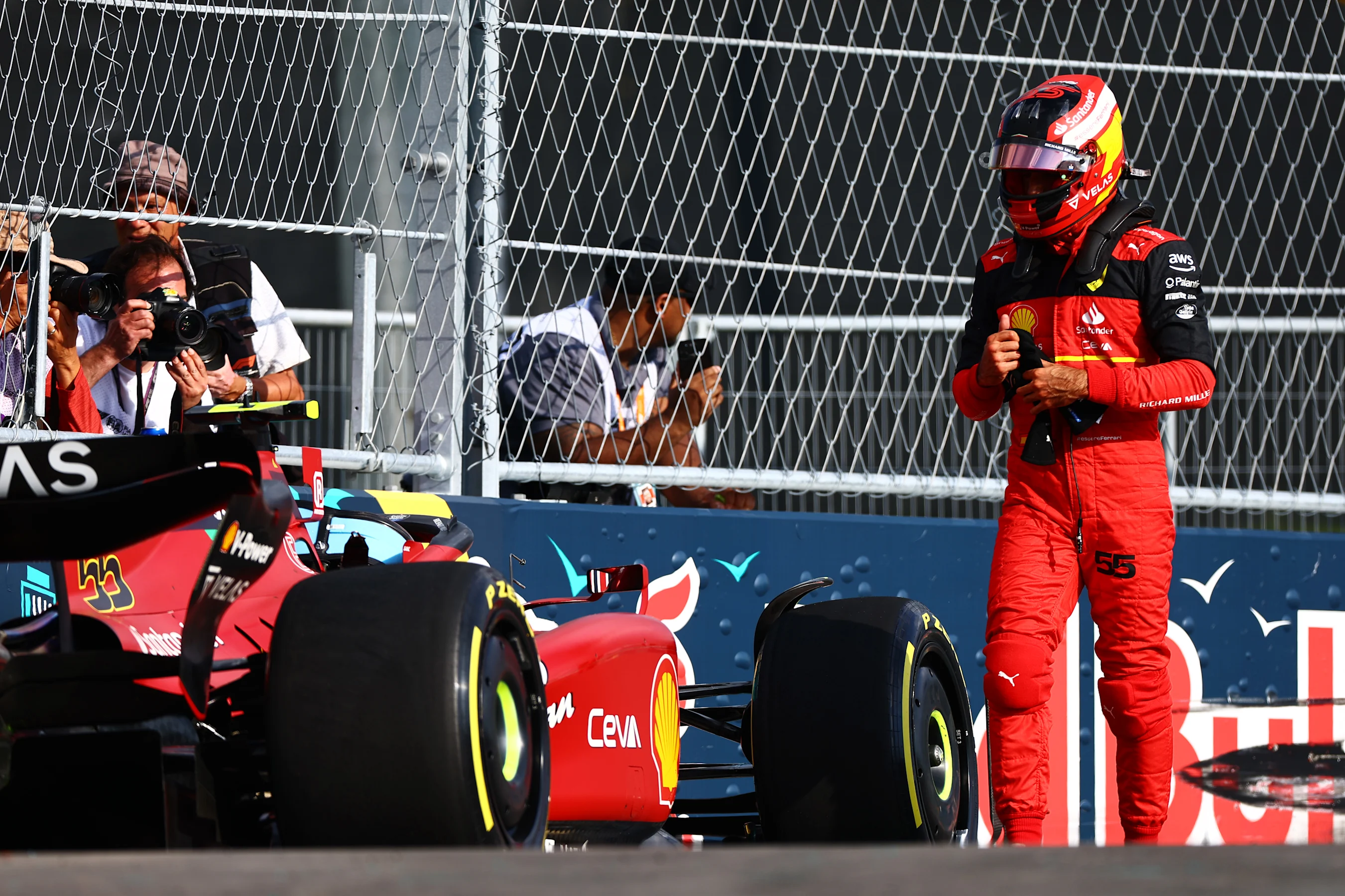 MIAMI, FLORIDA - MAY 06: Carlos Sainz of Spain and Ferrari walks away from his car after crashing