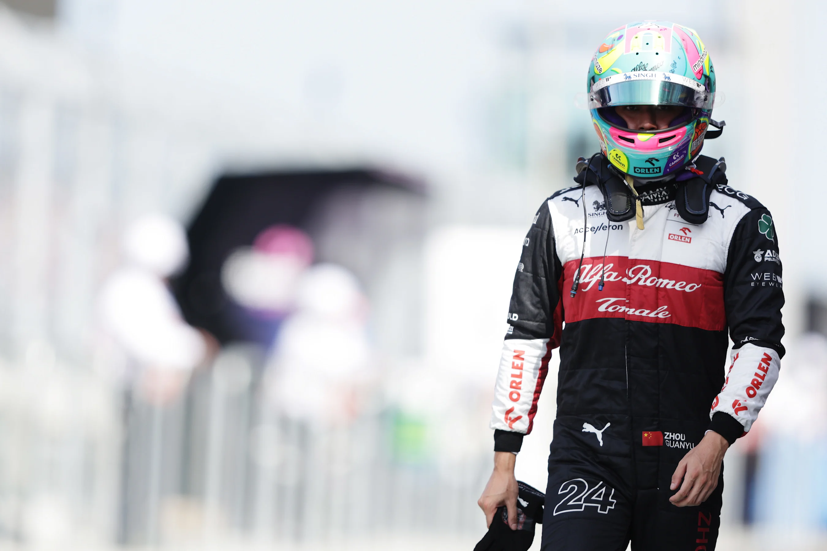 MIAMI, FLORIDA - MAY 07: 17th placed qualifier Zhou Guanyu of China and Alfa Romeo F1 walks in the