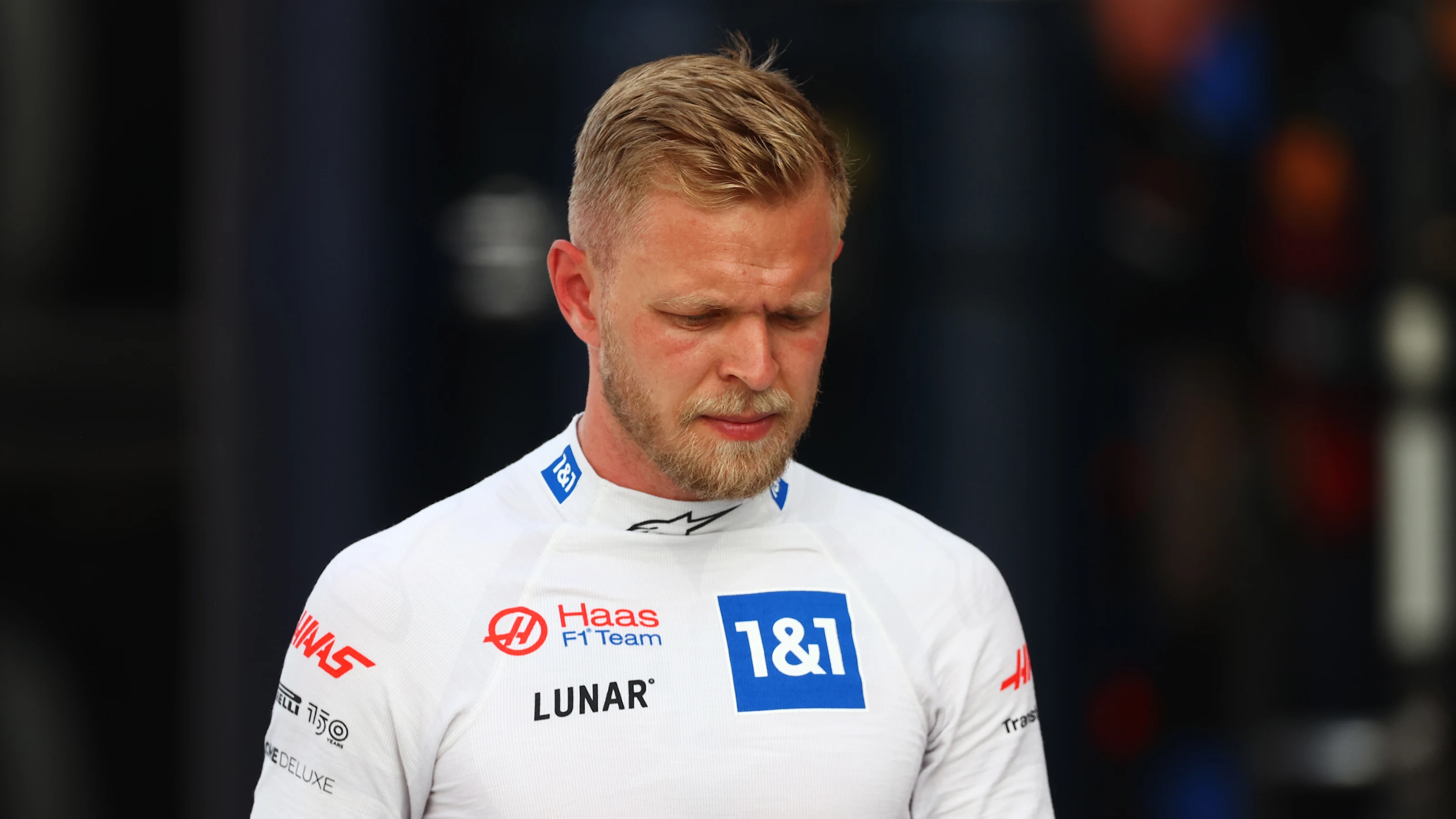 MIAMI, FLORIDA - MAY 07: 16th placed qualifier Kevin Magnussen of Denmark and Haas F1 walks in the