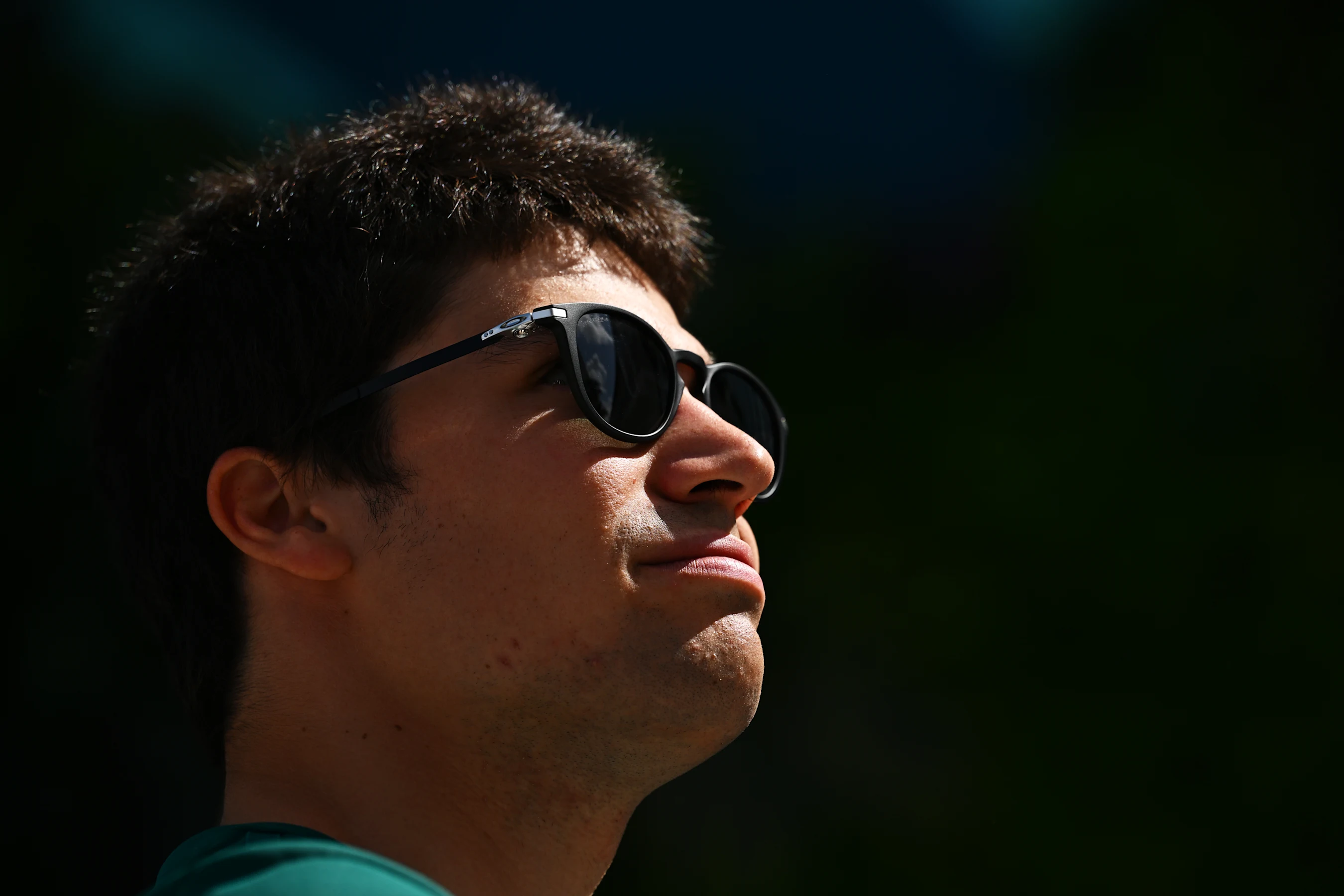 MIAMI, FLORIDA - MAY 08: Lance Stroll of Canada and Aston Martin F1 Team looks on in the Paddock