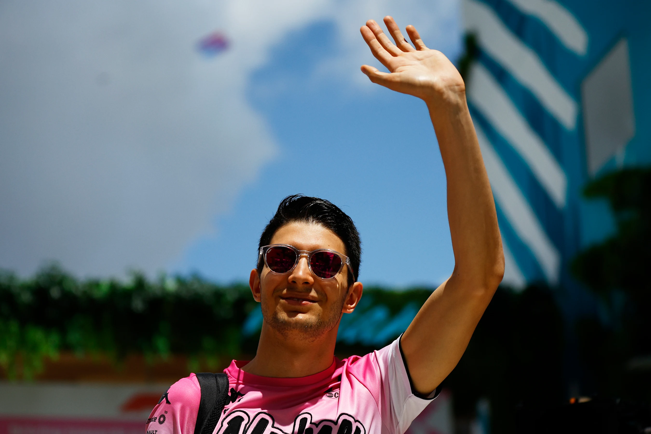 MIAMI, FLORIDA - MAY 08: Esteban Ocon of France and Alpine F1 waves to the crowd from the paddock
