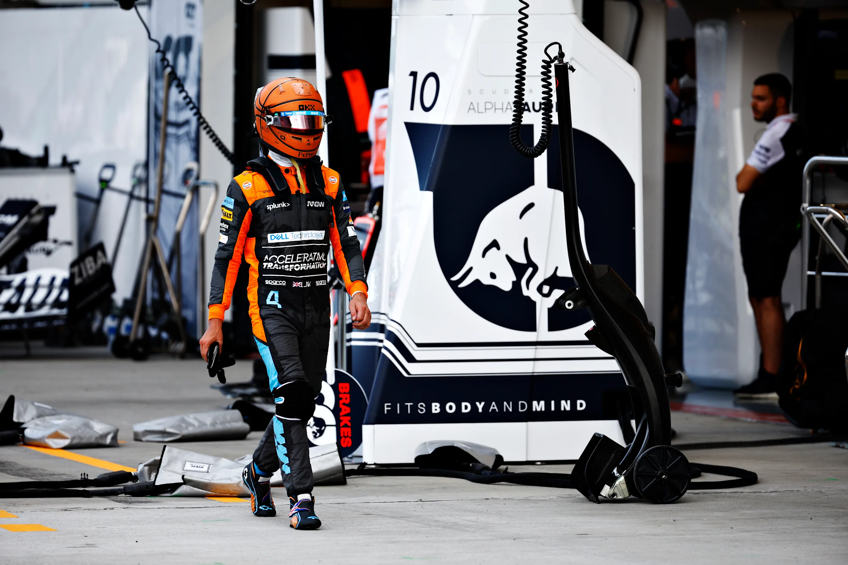 MIAMI, FLORIDA - MAY 08: Lando Norris of Great Britain and McLaren walks in the Pitlane after