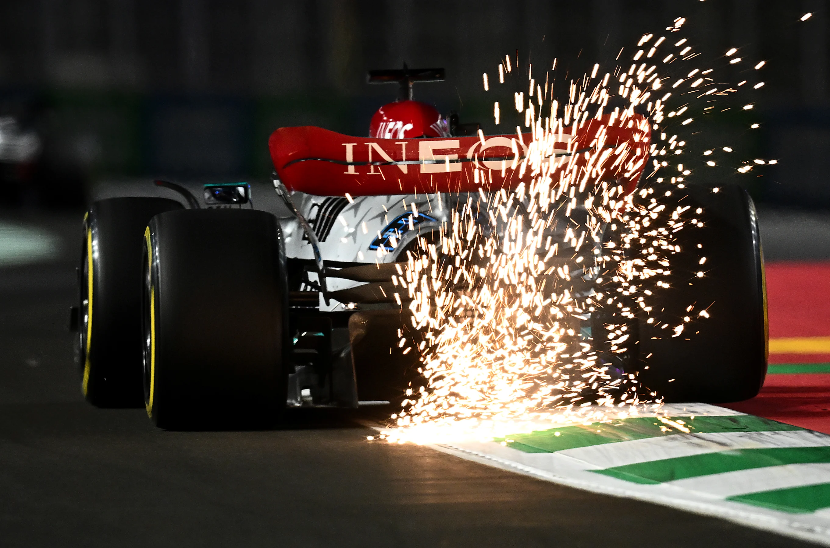 JEDDAH, SAUDI ARABIA - MARCH 25: Sparks fly behind George Russell of Great Britain driving the (63)