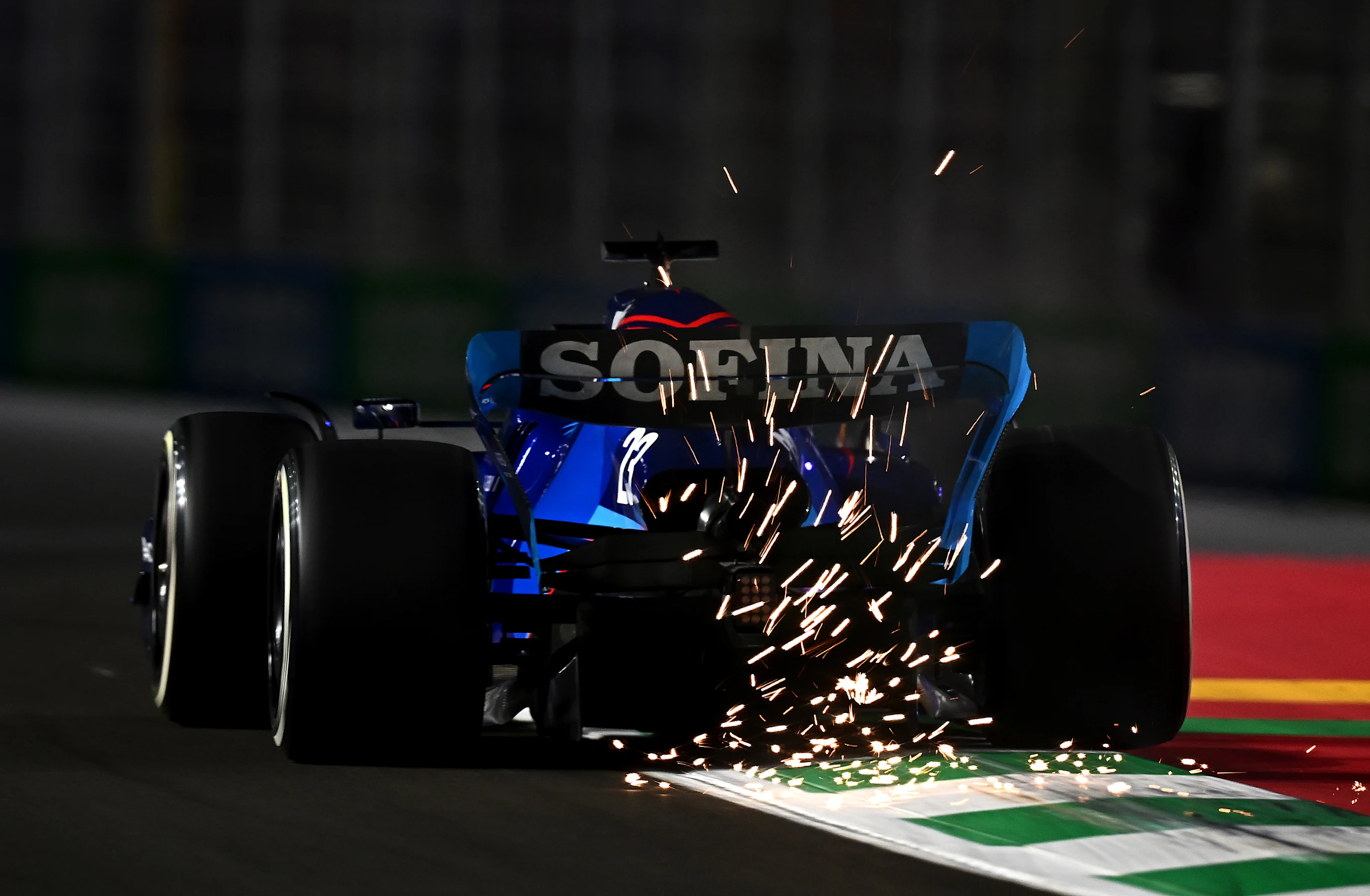 JEDDAH, SAUDI ARABIA - MARCH 25: Sparks fly behind Alexander Albon of Thailand driving the (23)