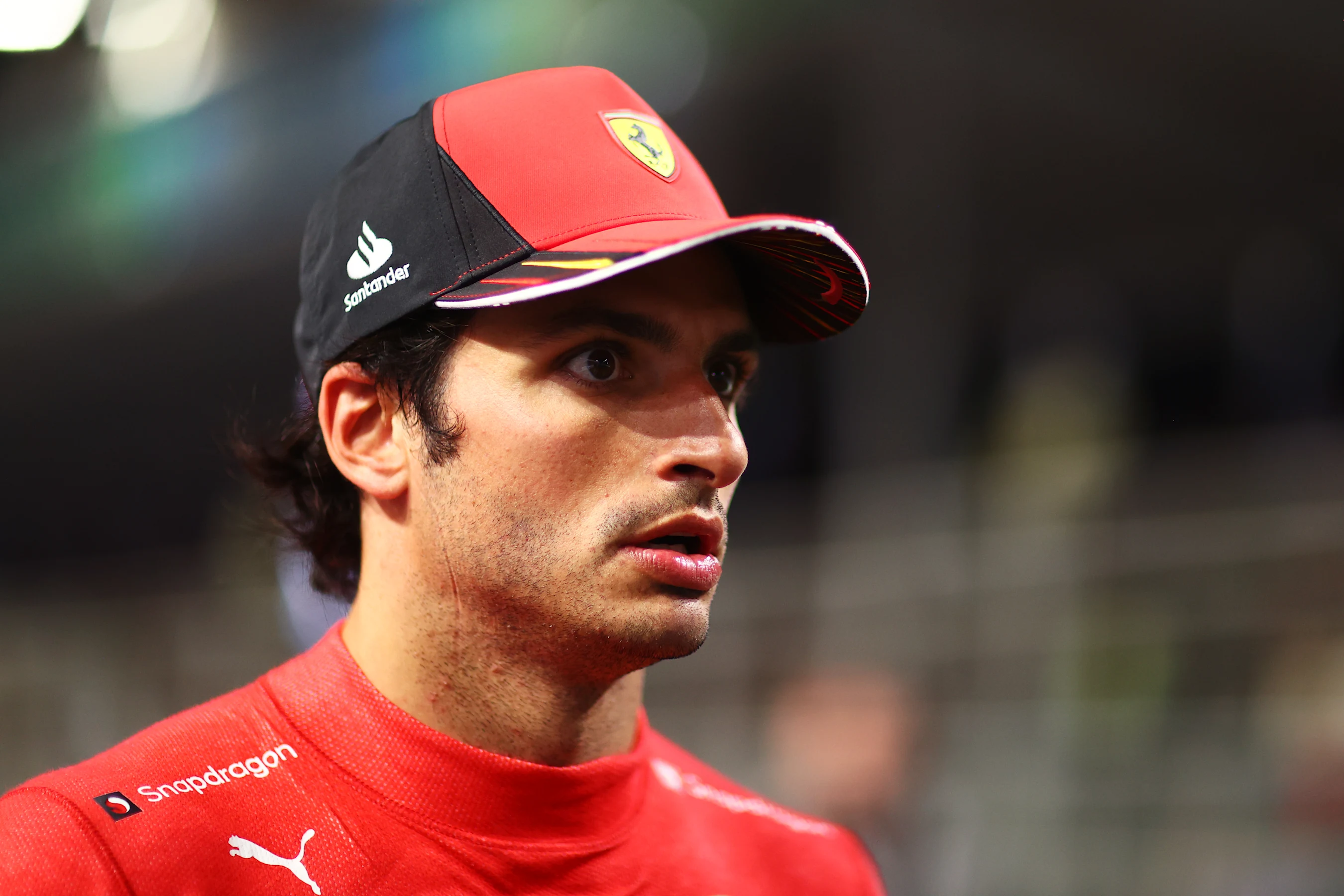 JEDDAH, SAUDI ARABIA - MARCH 26: Third placed qualifier Carlos Sainz of Spain and Ferrari walks in