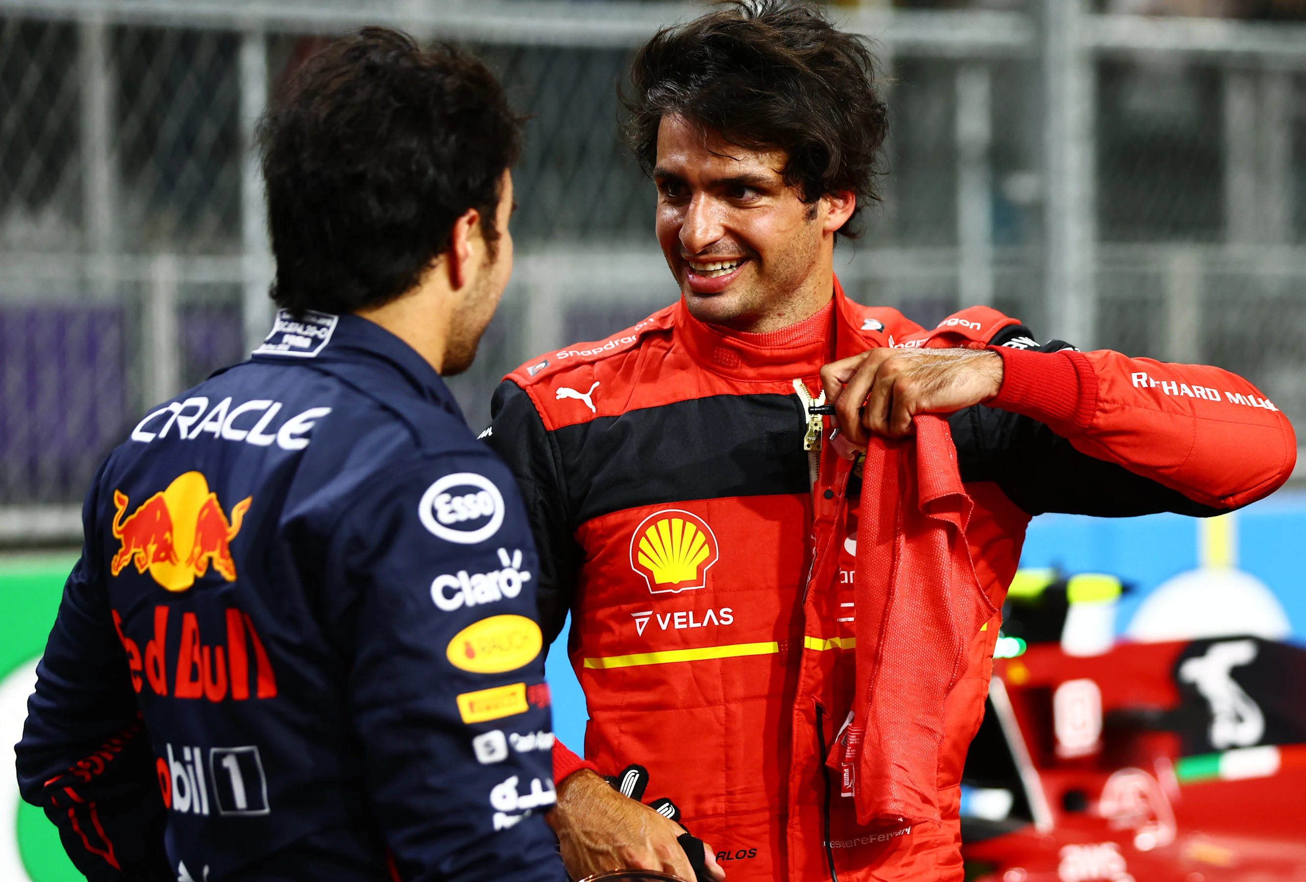 JEDDAH, SAUDI ARABIA - MARCH 26: Third place qualifier Carlos Sainz of Spain and Ferrari talks with