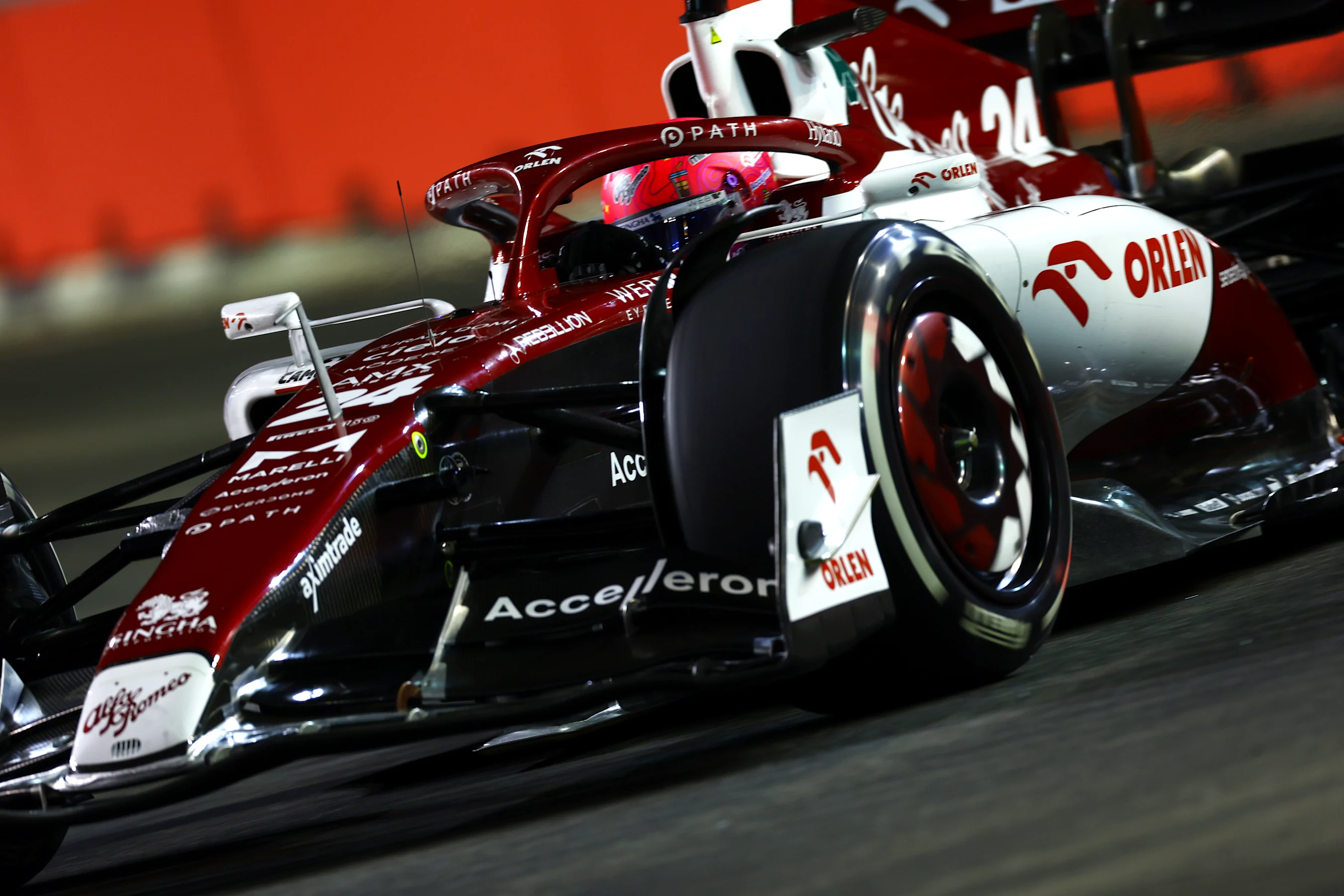 SINGAPORE, SINGAPORE - SEPTEMBER 30: Zhou Guanyu of China driving the (24) Alfa Romeo F1 C42