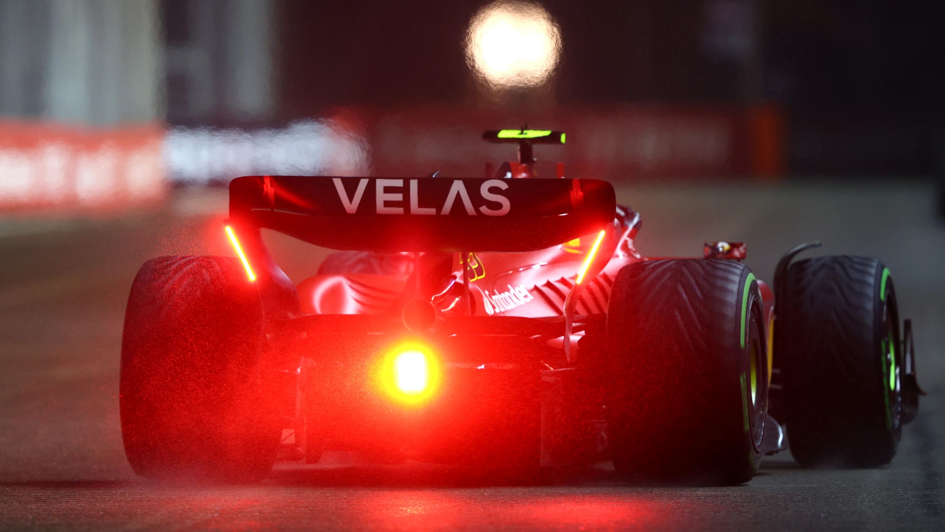 SINGAPORE, SINGAPORE - OCTOBER 01: Carlos Sainz of Spain driving (55) the Ferrari F1-75 on track