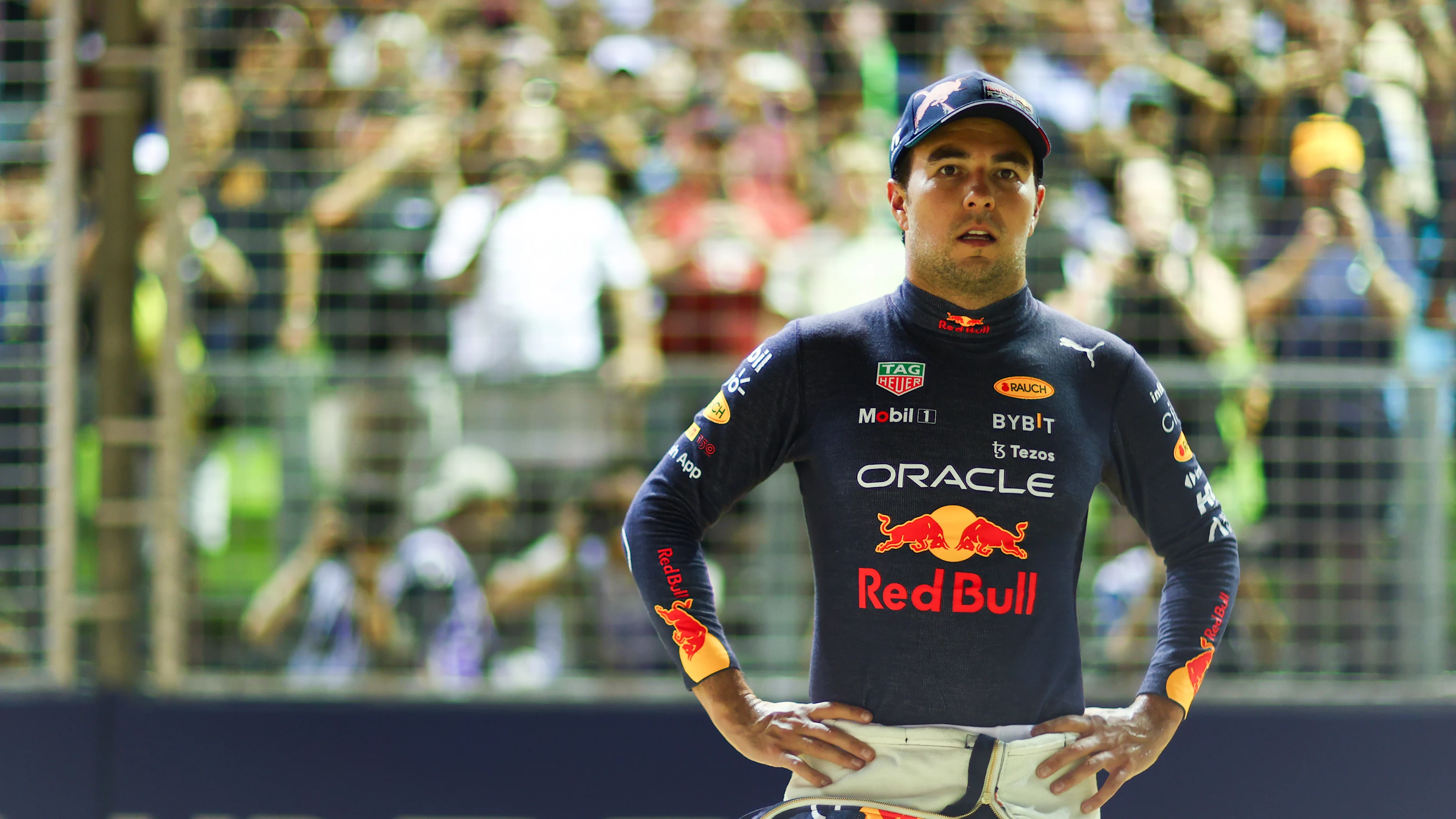 SINGAPORE, SINGAPORE - OCTOBER 01: Second placed qualifier Sergio Perez of Mexico and Oracle Red