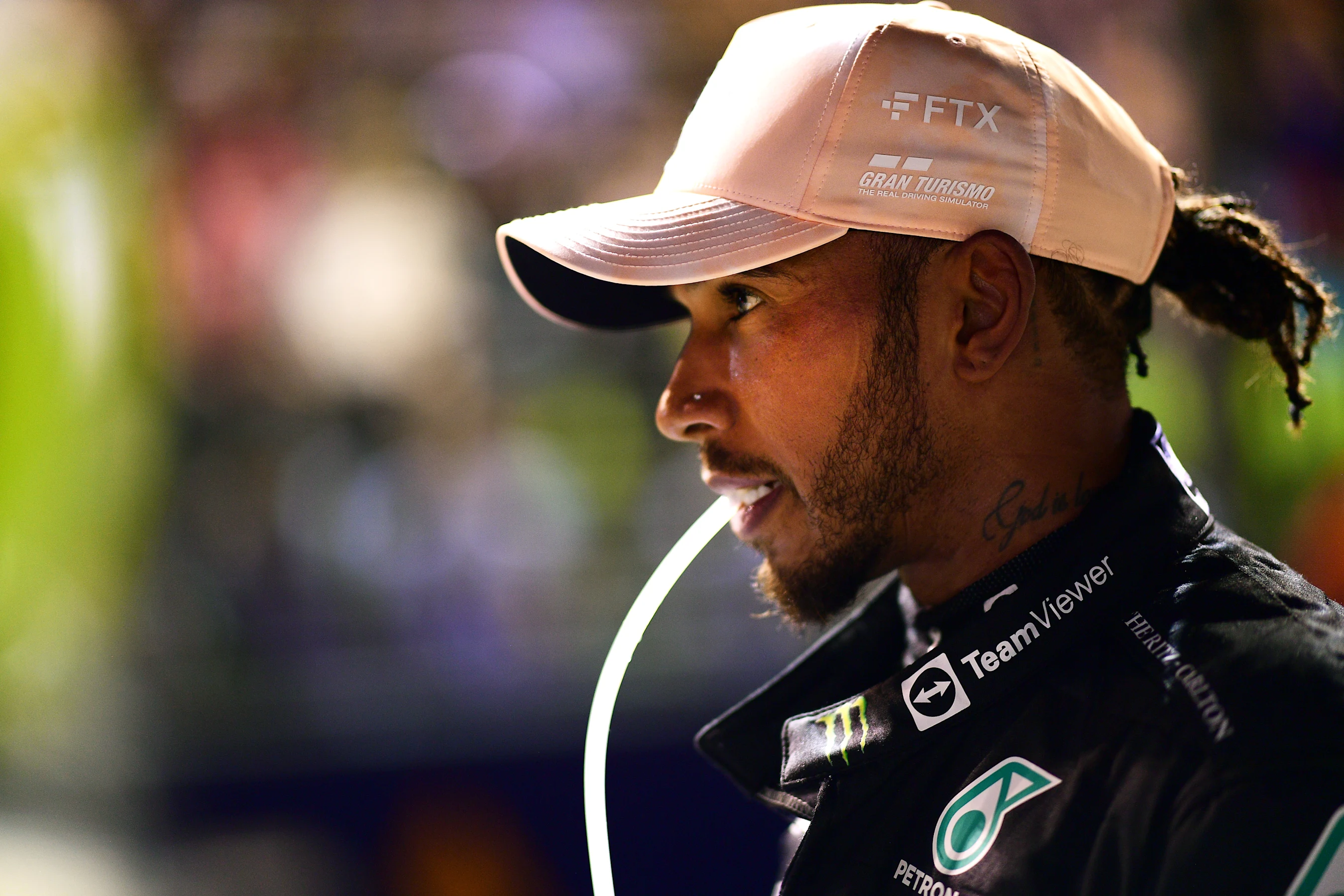 SINGAPORE, SINGAPORE - OCTOBER 01: Third placed qualifier Lewis Hamilton of Great Britain and
