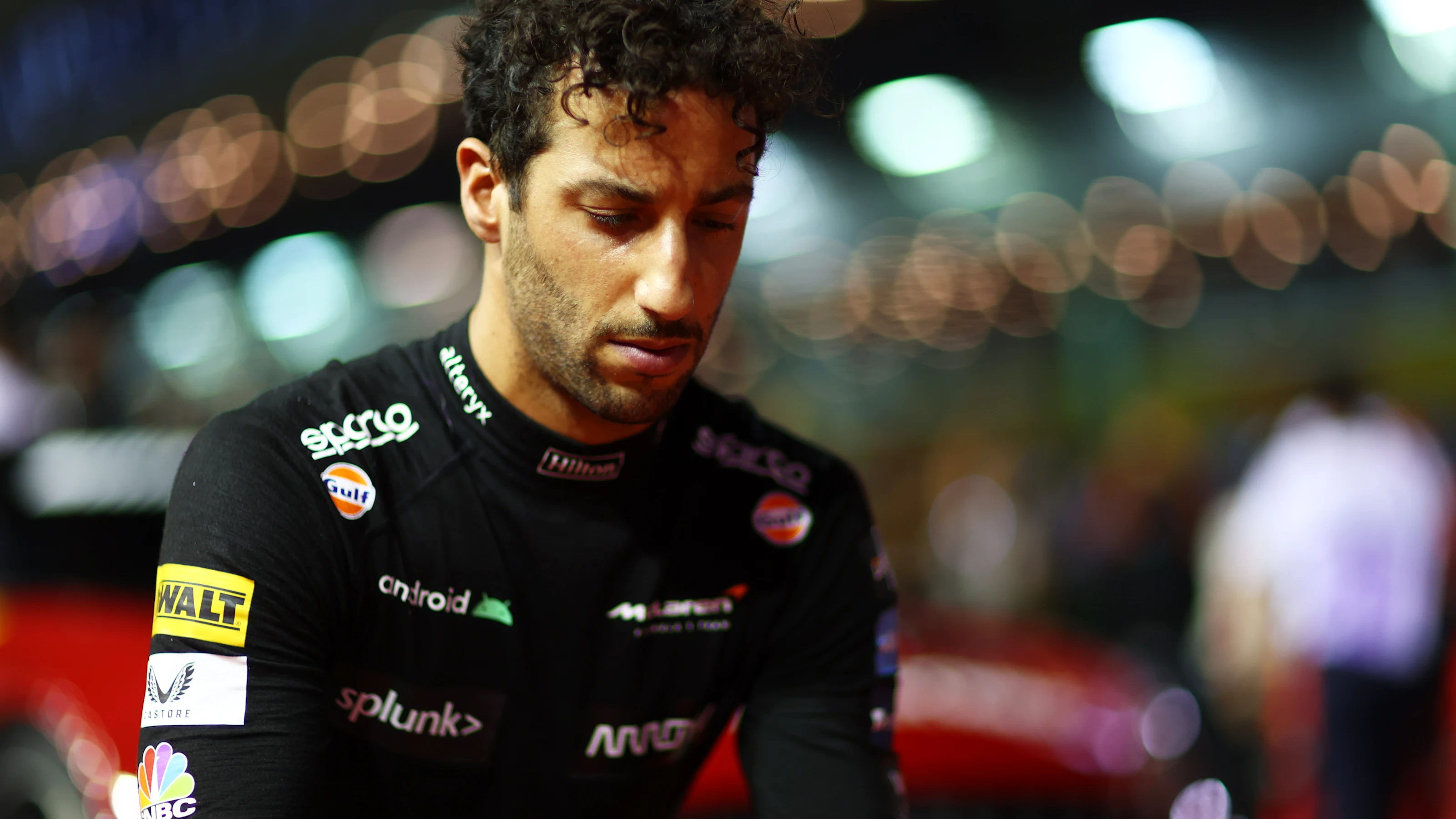 SINGAPORE, SINGAPORE - OCTOBER 02: Daniel Ricciardo of Australia and McLaren looks on from the grid