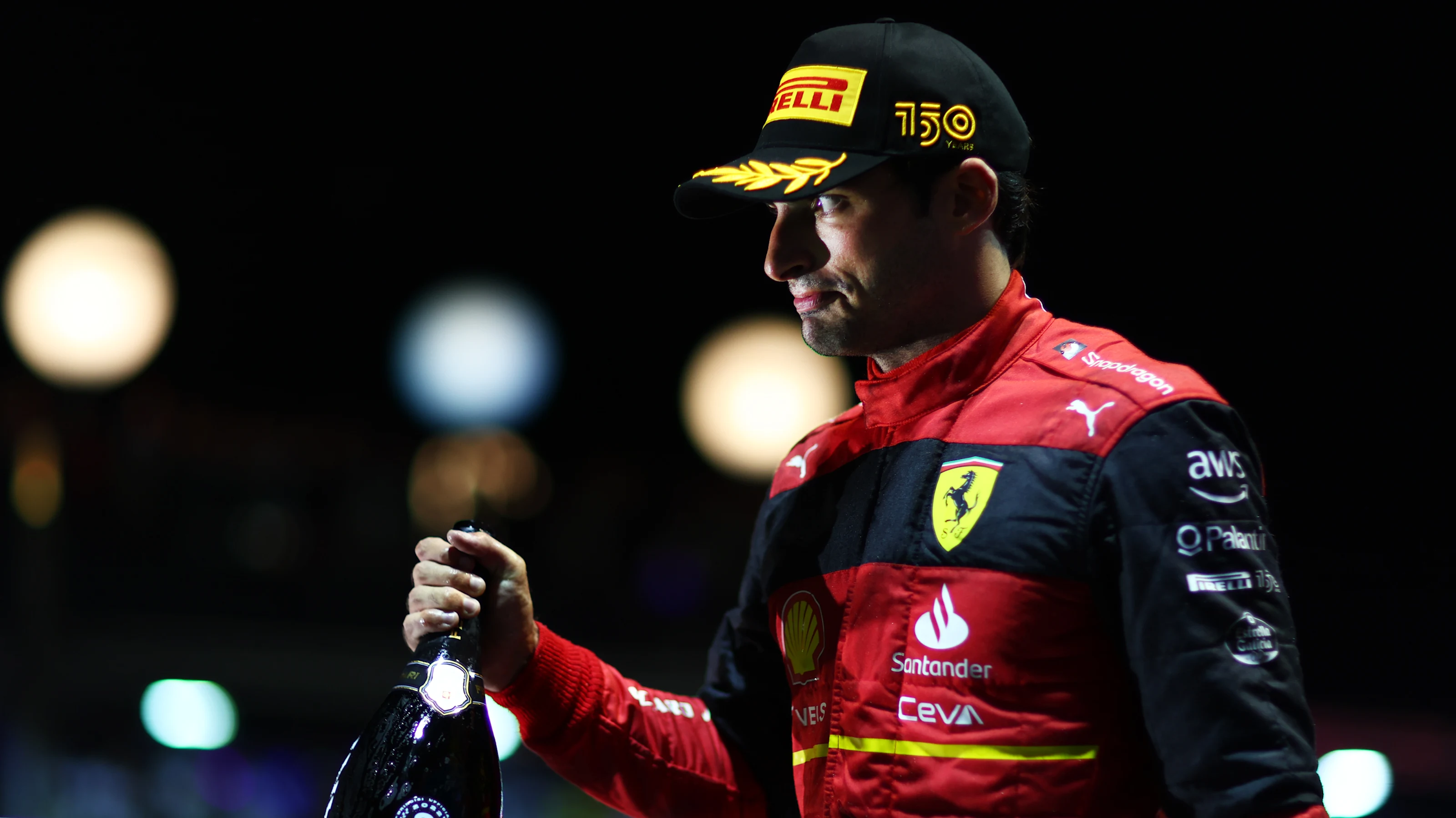 SINGAPORE, SINGAPORE - OCTOBER 02: Third placed Carlos Sainz of Spain and Ferrari celebrates on the