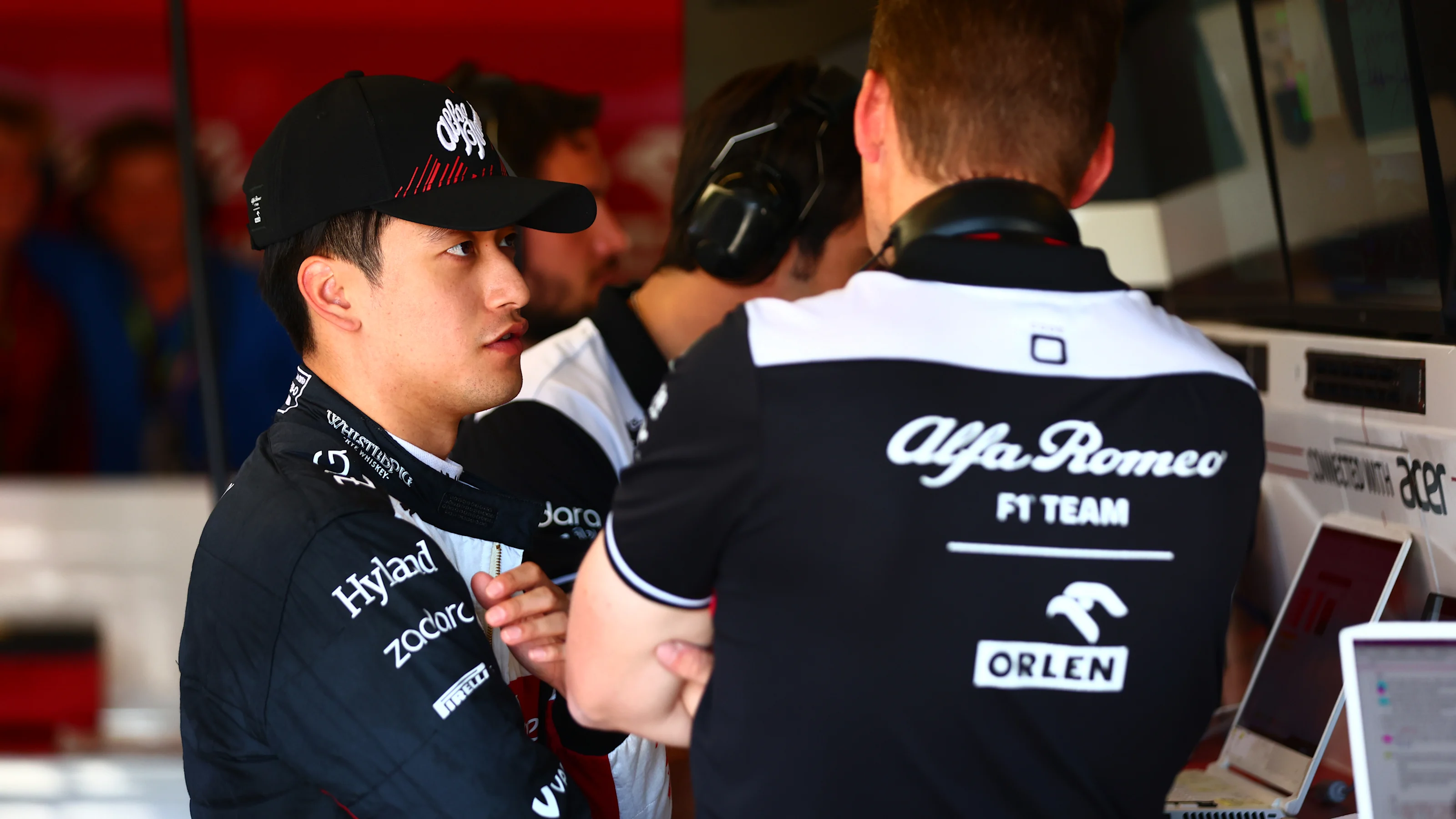 AUSTIN, TEXAS - OCTOBER 22: Zhou Guanyu of China and Alfa Romeo F1 in the garage prior to final