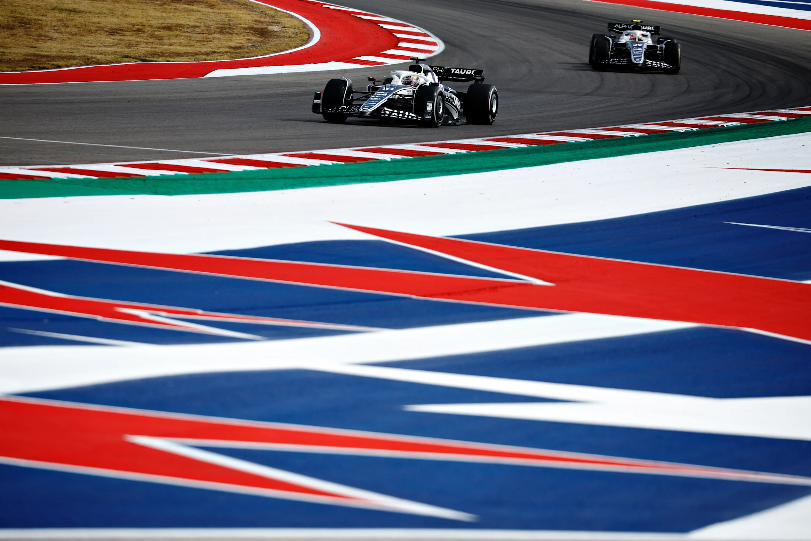 AUSTIN, TEXAS - OCTOBER 23: Pierre Gasly of France driving the (10) Scuderia AlphaTauri AT03 leads