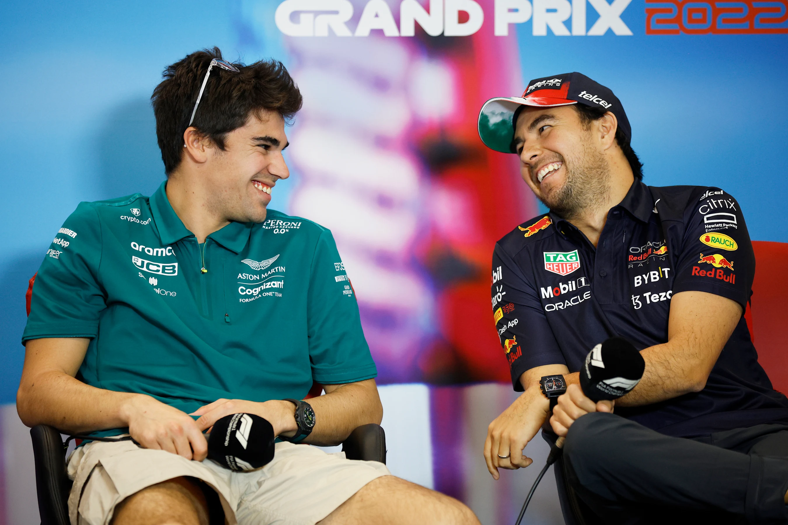 AUSTIN, TEXAS - OCTOBER 20: Lance Stroll of Canada and Aston Martin F1 Team and Sergio Perez of