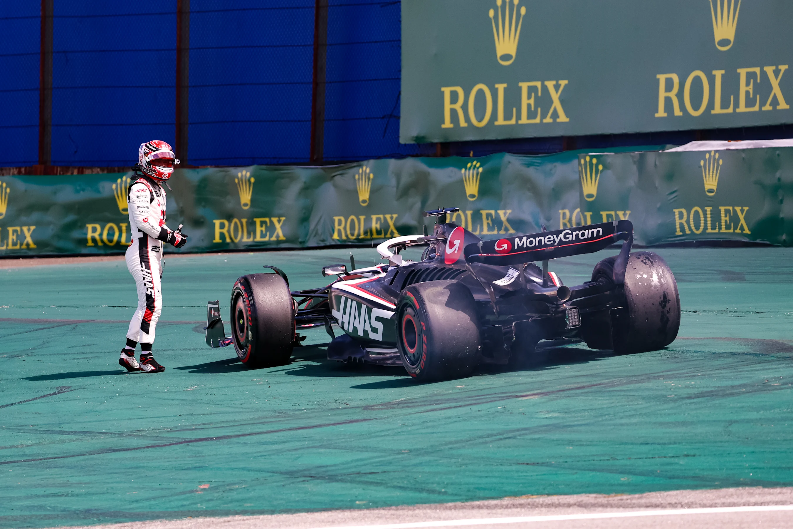 SAO PAULO, BRAZIL - NOVEMBER 5: Kevin Magnussen of Denmark and Haas F1 walks away from his car