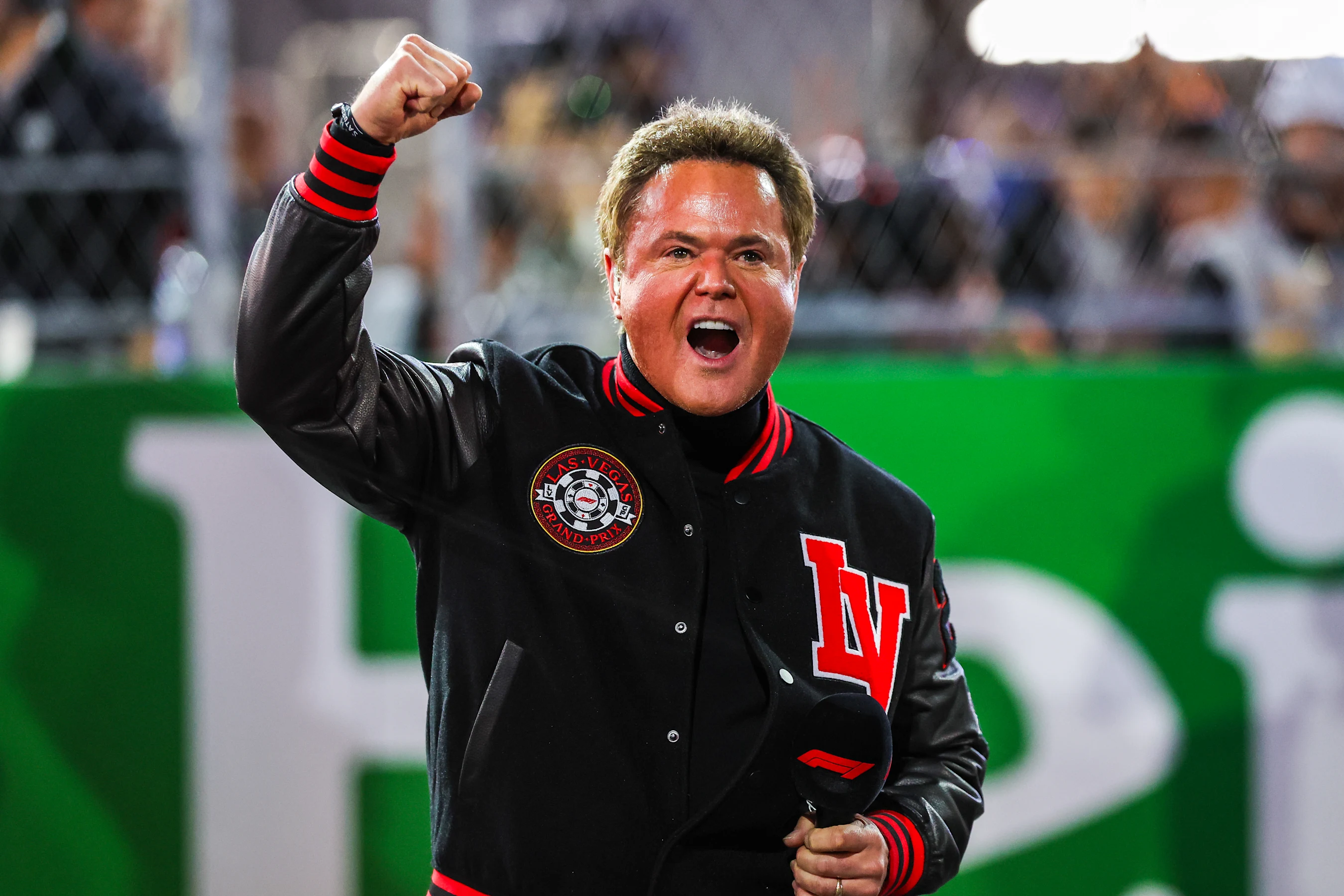 LAS VEGAS, NEVADA - NOVEMBER 18: Donny Osmond singing the National Anthem prior to the F1 Grand