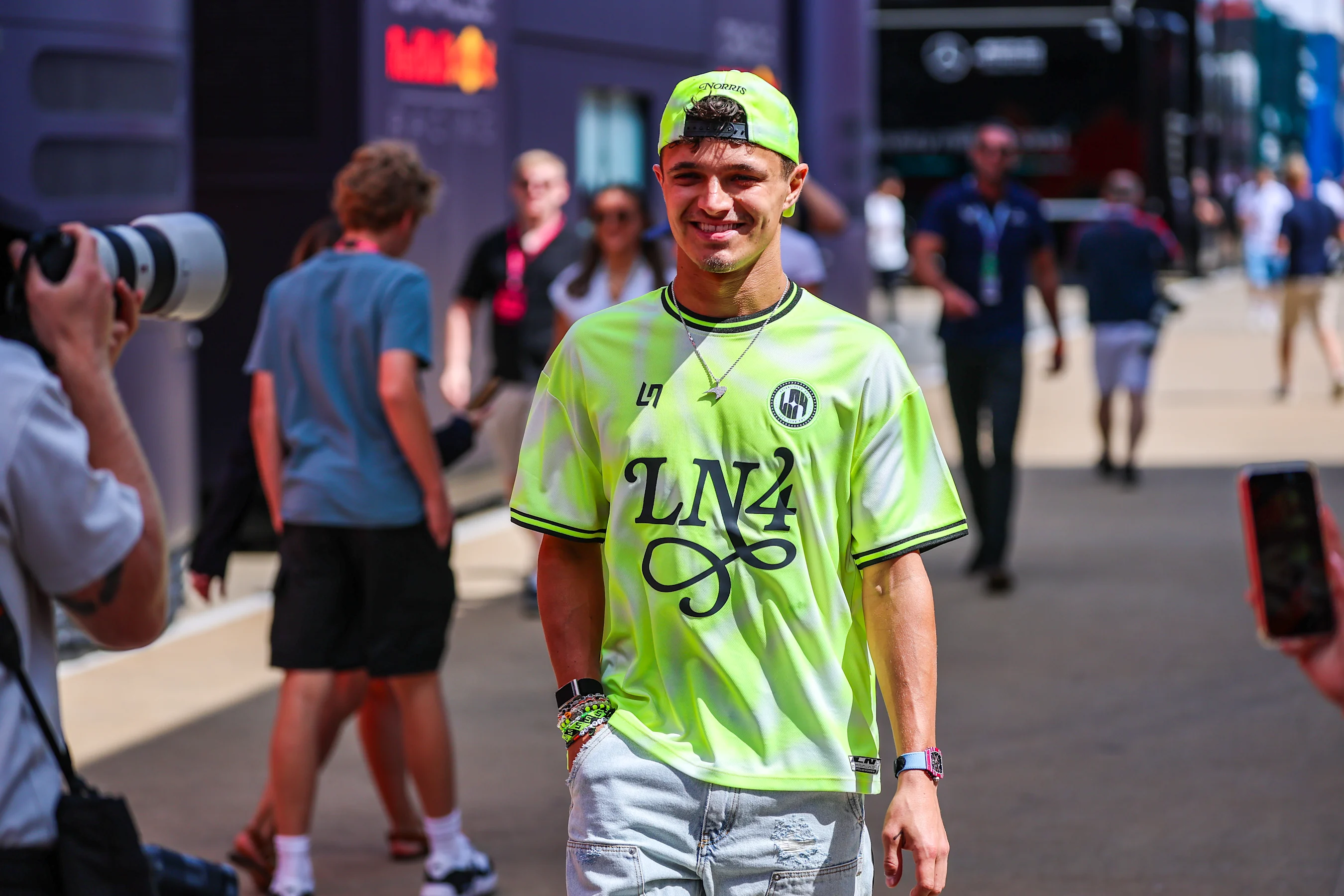NORTHAMPTON, ENGLAND - JULY 3: Lando Norris of Great Britain and McLaren walks through the paddock