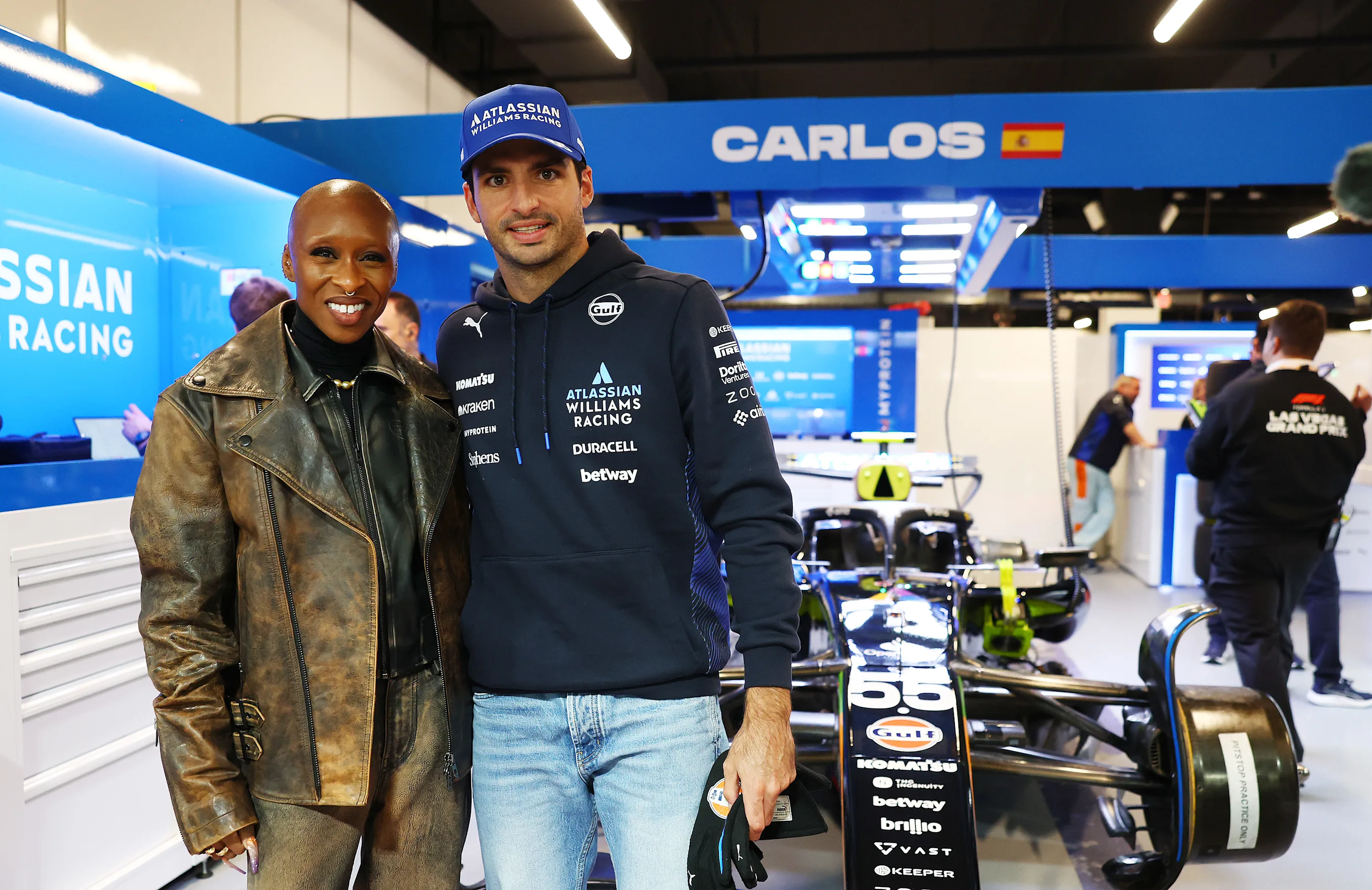 LAS VEGAS, NEVADA - NOVEMBER 22: Cynthia Erivo in the Williams garage with Carlos Sainz of Spain