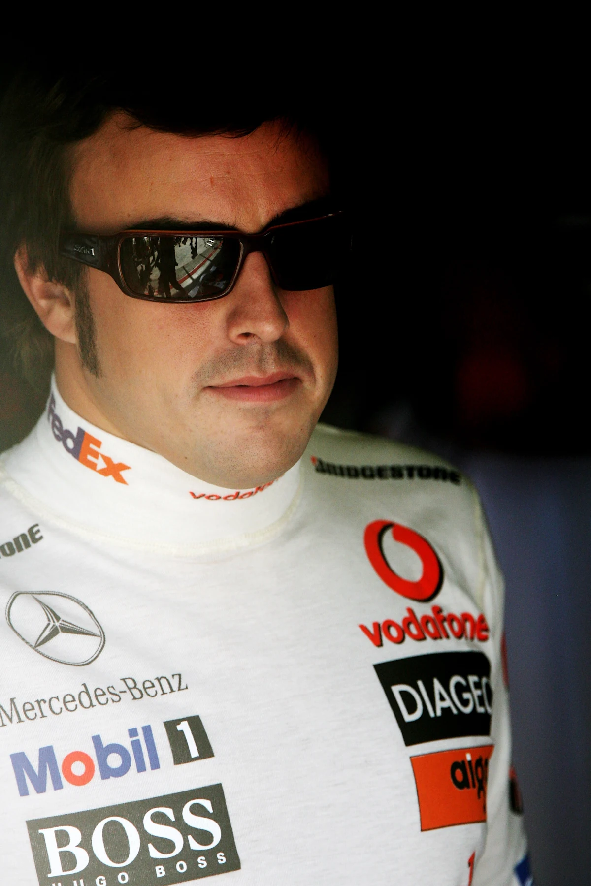 ISTANBUL, TURKEY - AUGUST 25:  Fernando Alonso of Spain and McLaren Mercedes looks on in the pits