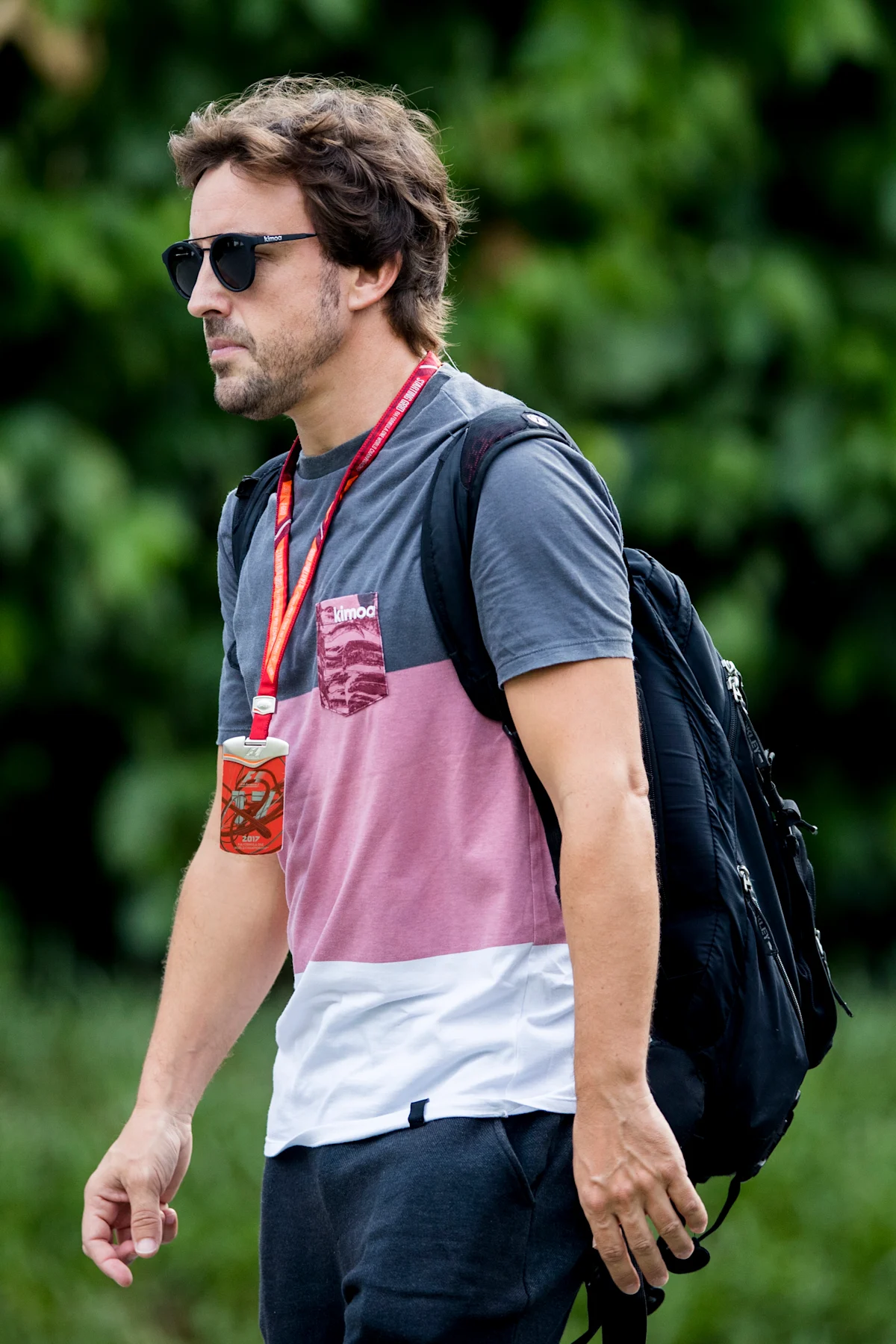 SINGAPORE - SEPTEMBER 14:  Fernando Alonso of Spain and McLaren Honda walks in the Paddock during
